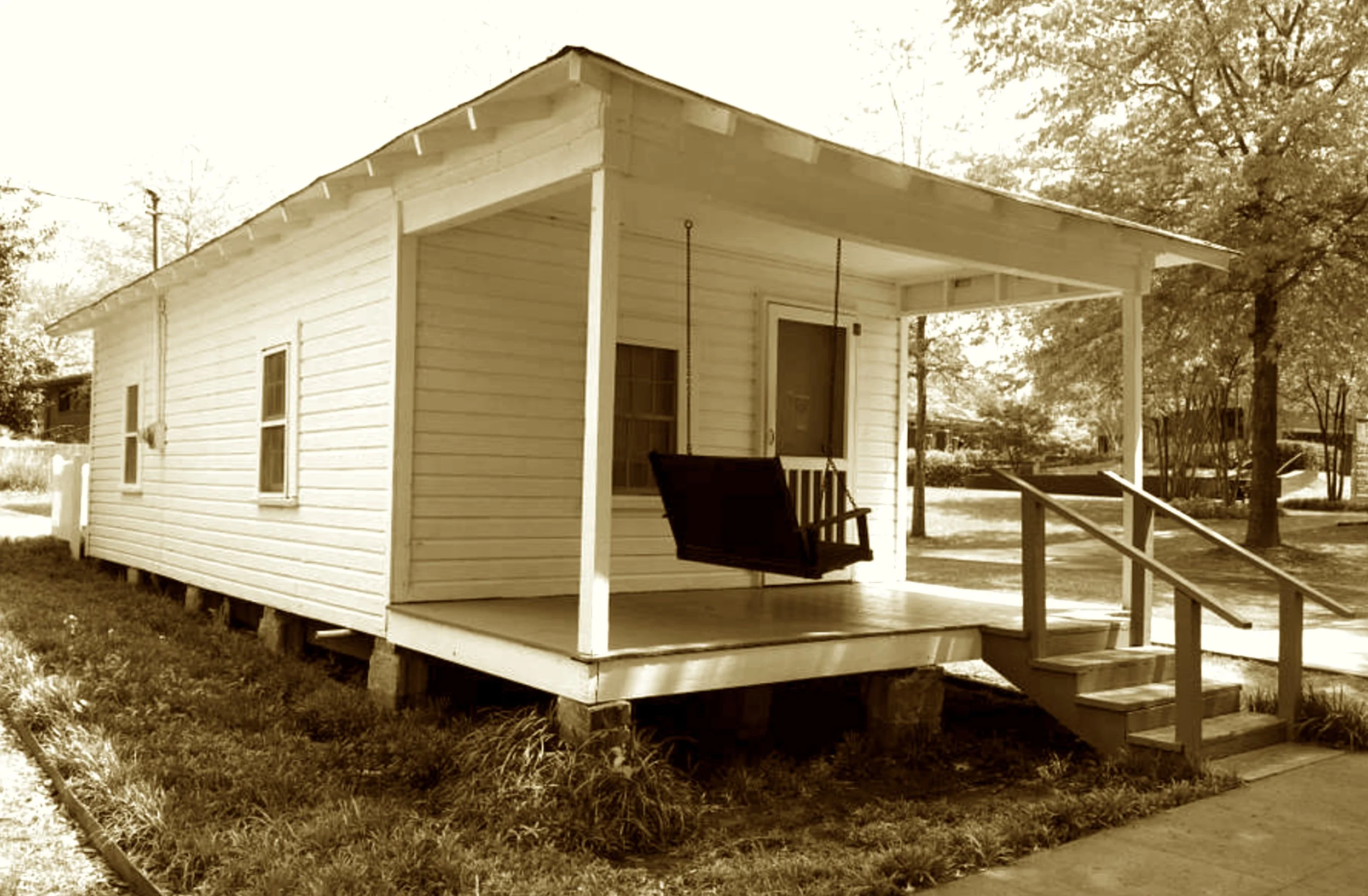 He strummed his first chords on a gifted guitar,
From shotgun house to national star.
The boy from Tupelo took the stage
And rocked the world from age to age.
This tiny home, so plain and bare,
Housed the King before the flare.
