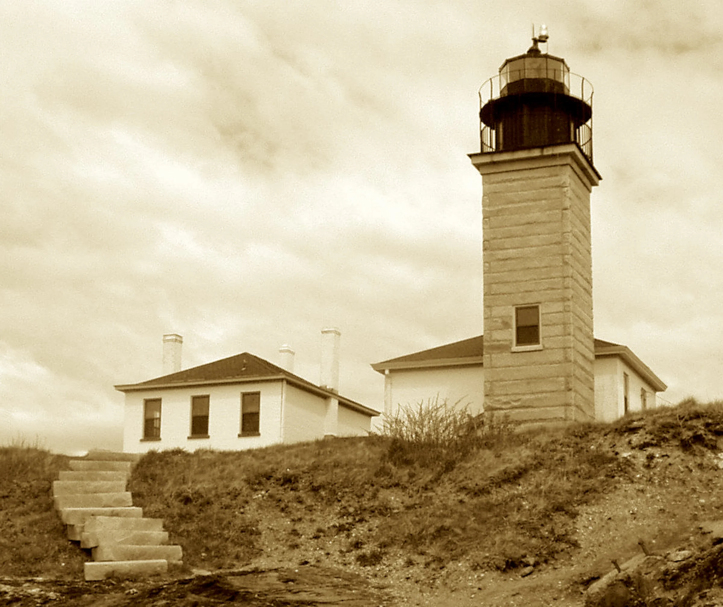 Where beavers point and breakers roll,
A granite tower plays its role—
To guard the bay and calm the shoal.
It’s watched the wars, it’s braved the squalls,
Its steadfast eye on all that calls—
To Rhode Island’s rugged coastal walls.