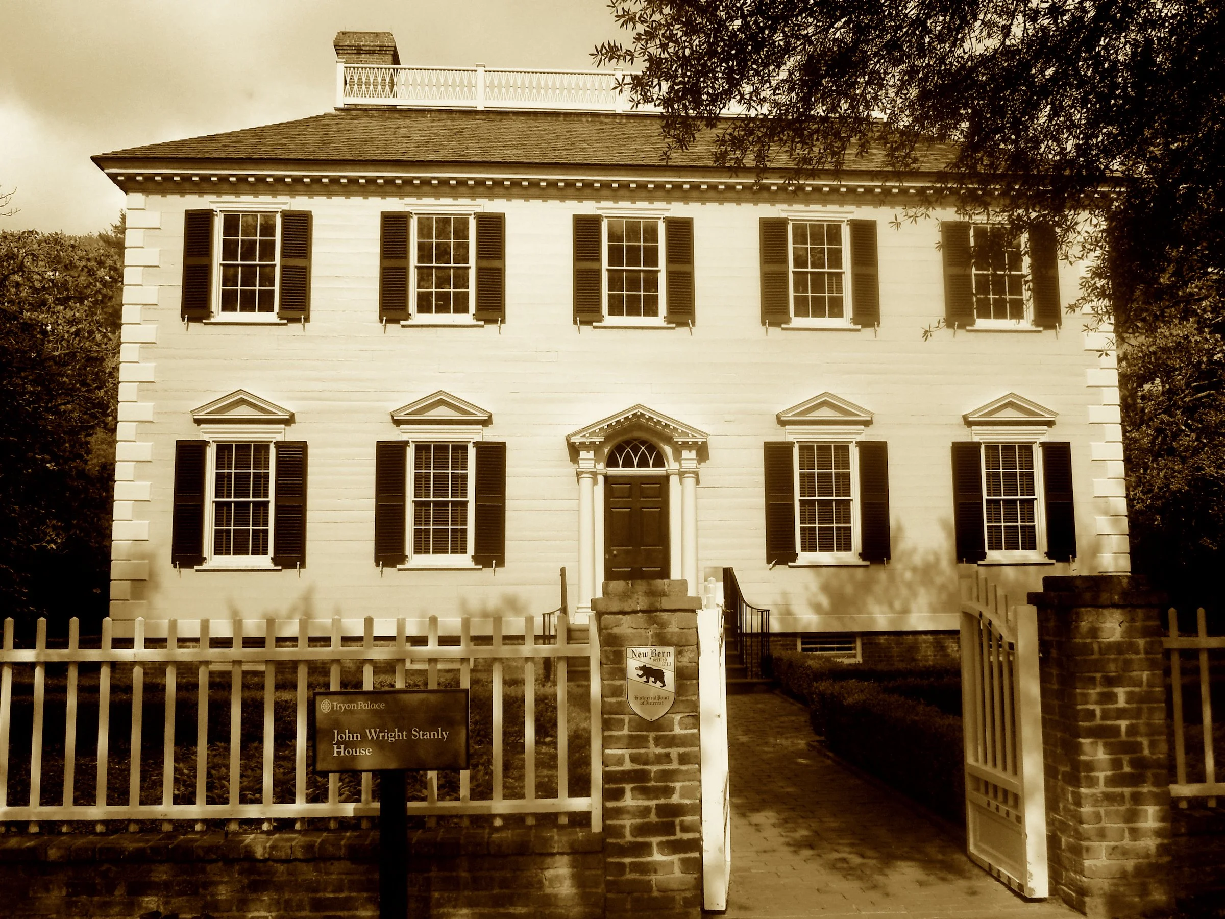 He backed the cause with ships and gold,
A patriot’s tale in pine is told.
Georgian grace where grief once stayed—this stately home John Stanly made.