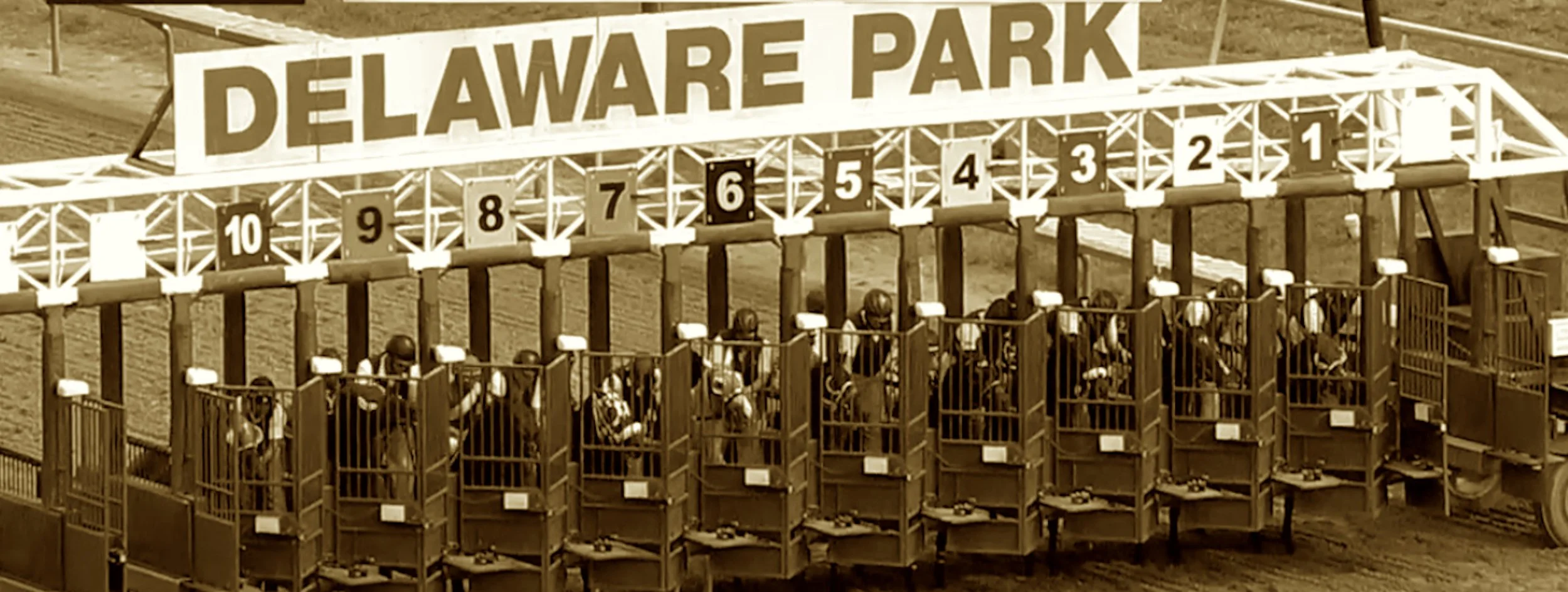 Where horses race and crowds convene,
A sporting palace once so keen.
Du Pont’s dream and racing lore,
Betting windows, stakes, and more.
Find the track where champions run,
Under Delaware’s bright sun.