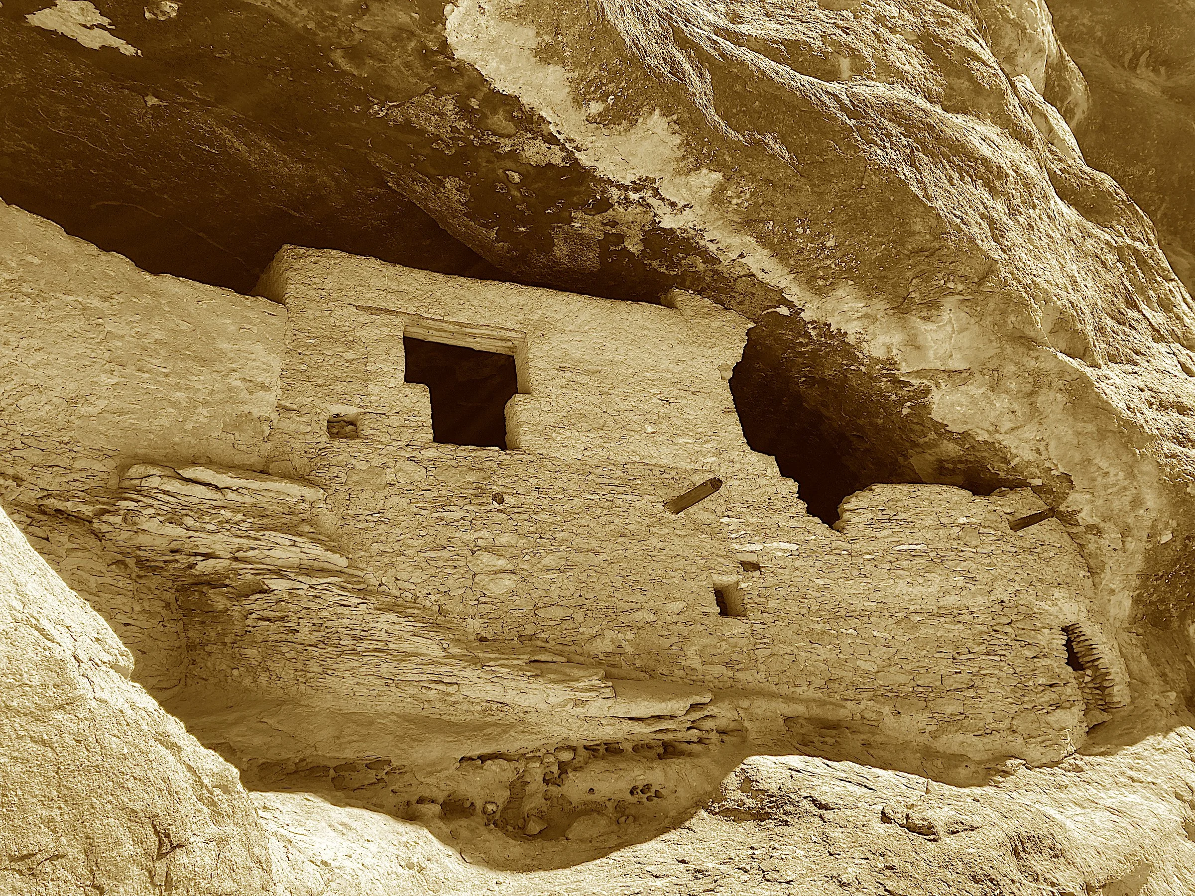Ailman escaped from the jury’s dull task,
And stumbled on secrets in caverns unmasked.
The Mogollon carved out their homes in the stone,
A dozen or more in this tucked-away zone.
They hunted and gathered through canyons so wide,
Then vanished, as sof