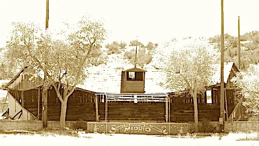 Where coal fed the engines and miners took swings,
They built a fine ballpark from salvaged things.
With tin-covered stands and stone walls aglow,
It hosted night games with a magical show.
Now artists and dreamers keep memories alive—
In the ghost o