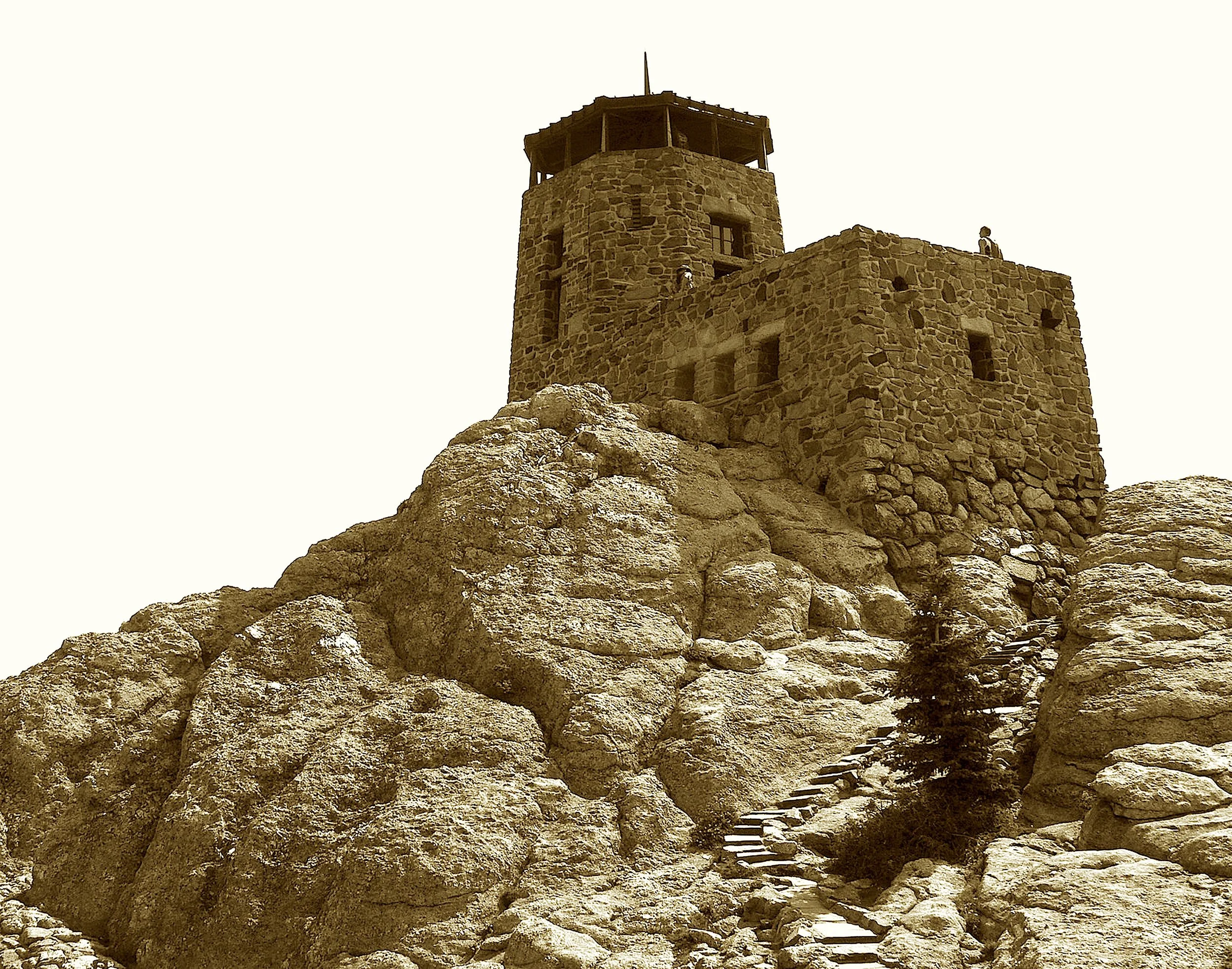 Once named for war and wrongly crowned,
This mountain held a tale profound.
A tower rose on sacred height
To catch the dawn and mountain light.
Now Black Elk’s name the stone uplifts—
A peak reclaimed with healing gifts.