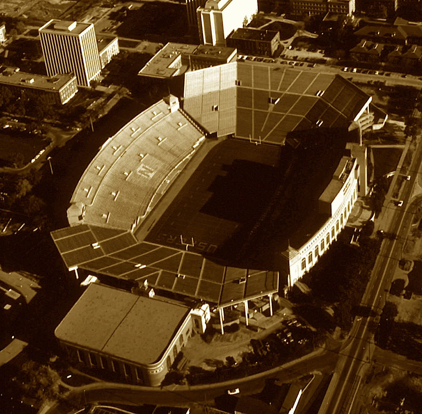 A sea of red, a sacred sound—
The Tunnel Walk, the Husker hound—
Where sellouts stack the city’s bound.
Since ’23, this field has roared,
From fields once barely roomed or floored—
Now legends rise with every score.