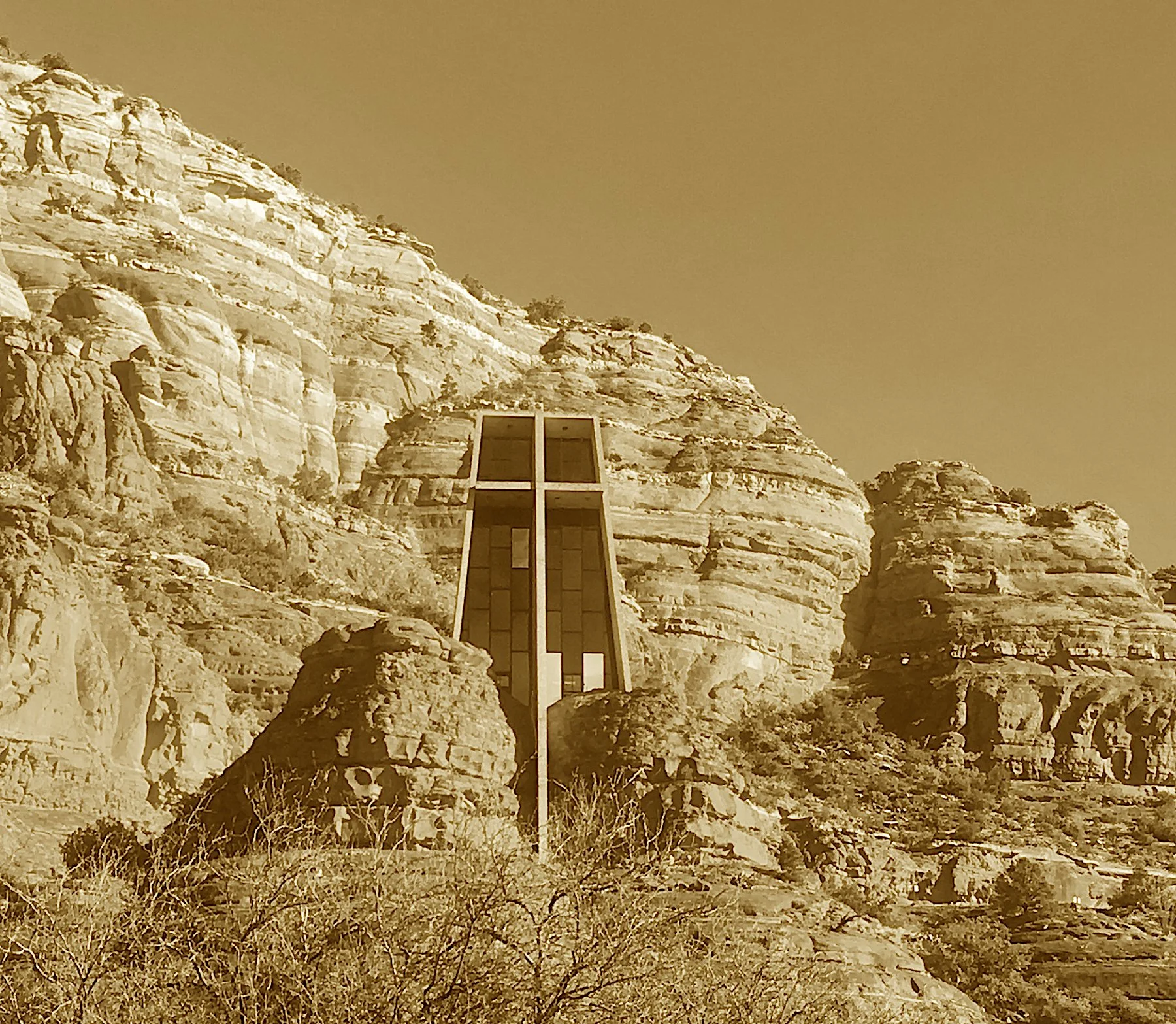 A sculptor’s dream in red rock led,
Where cross and canyon spirit wed.
A vision born of Empire’s spire, now soars from stone in sacred choir.