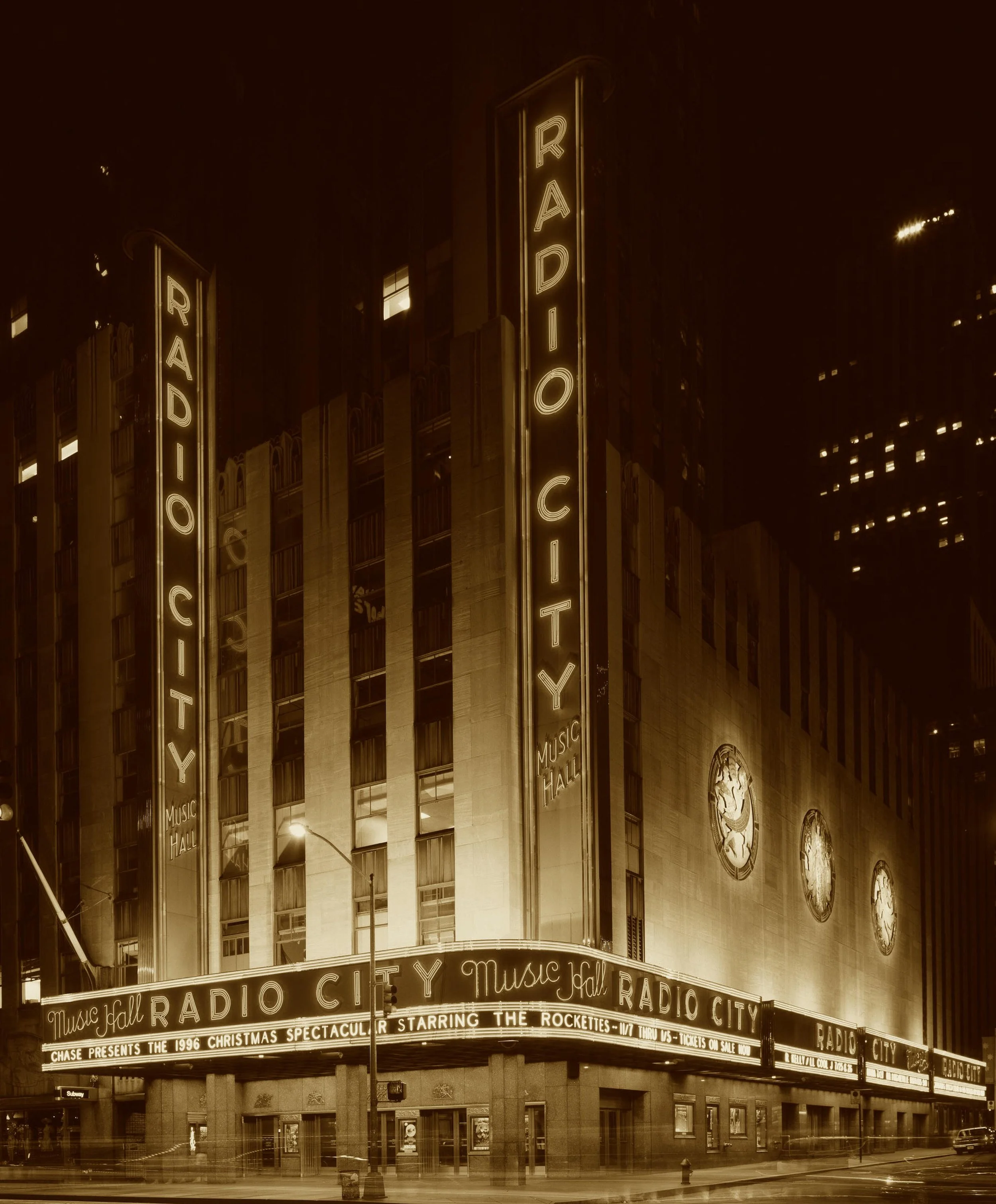 A crash, a lease, a grand rebirth—
The Rockettes twirled in Radio’s mirth.
A block-long glow, a golden dome,
Where modern made itself a home.
Deskey’s gem with velvet grace—
America’s most sparkling place.