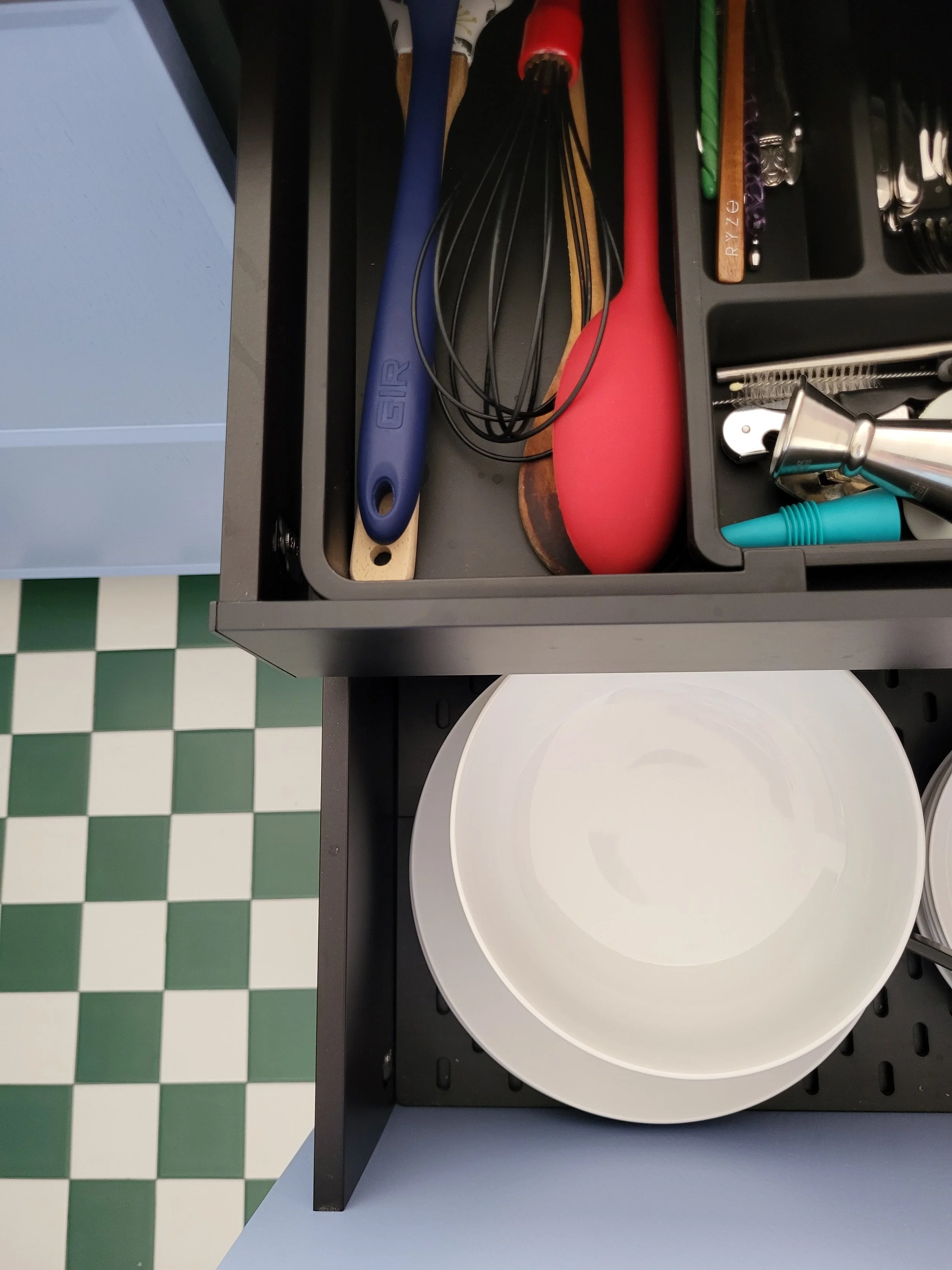 Layers of kitchen storage. Fireclay tile and Reform cabinets.