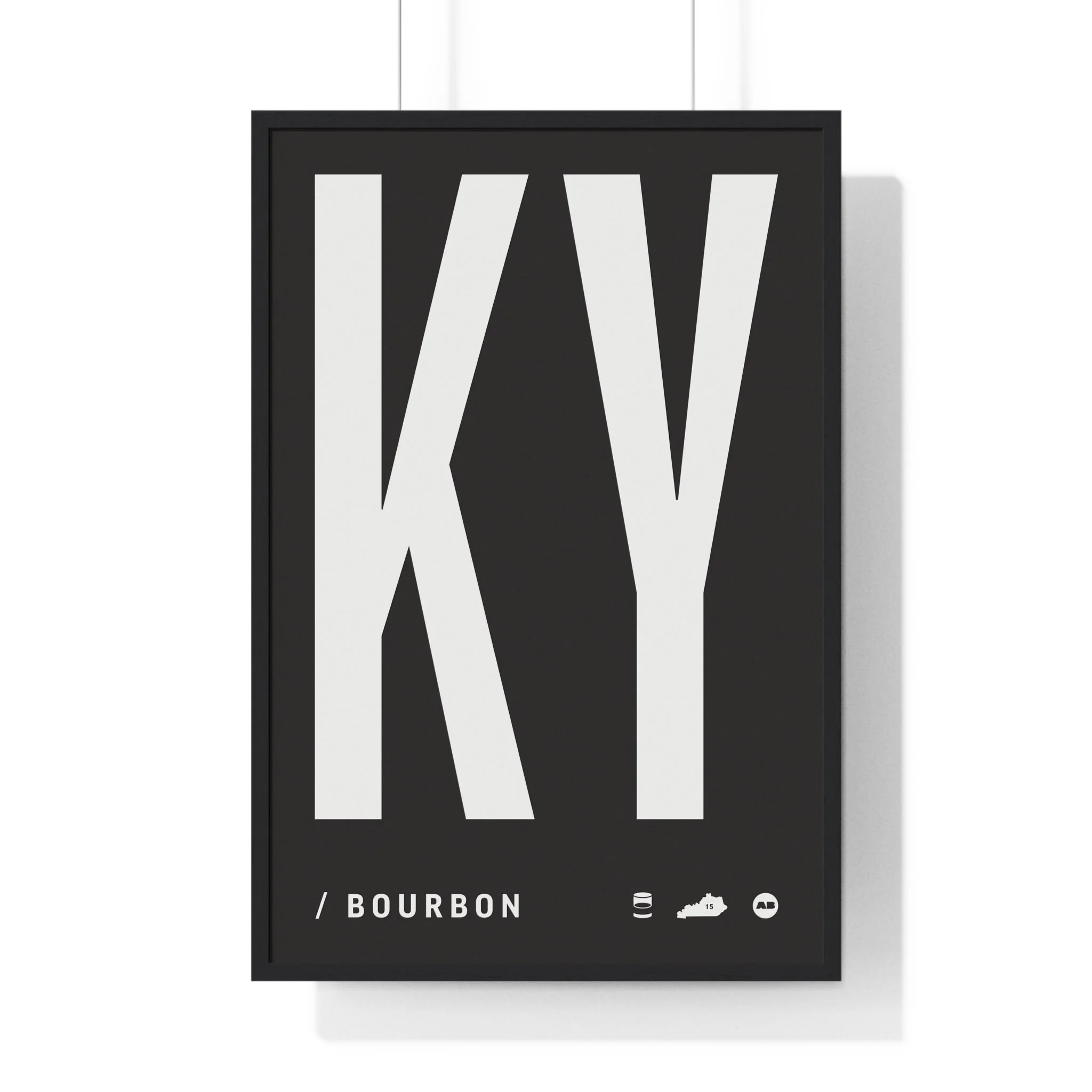 A black poster with large white letters spelling 'KY' and smaller text reading '/ BOURBON' underneath. Includes icons of a barrel, Kentucky outline, bottle, and a circle.