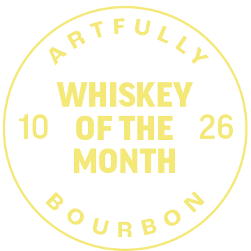 A circular badge with the words "Artfully Bourbon Whiskey of the Month" and the numbers 10 and 26 on a black background.