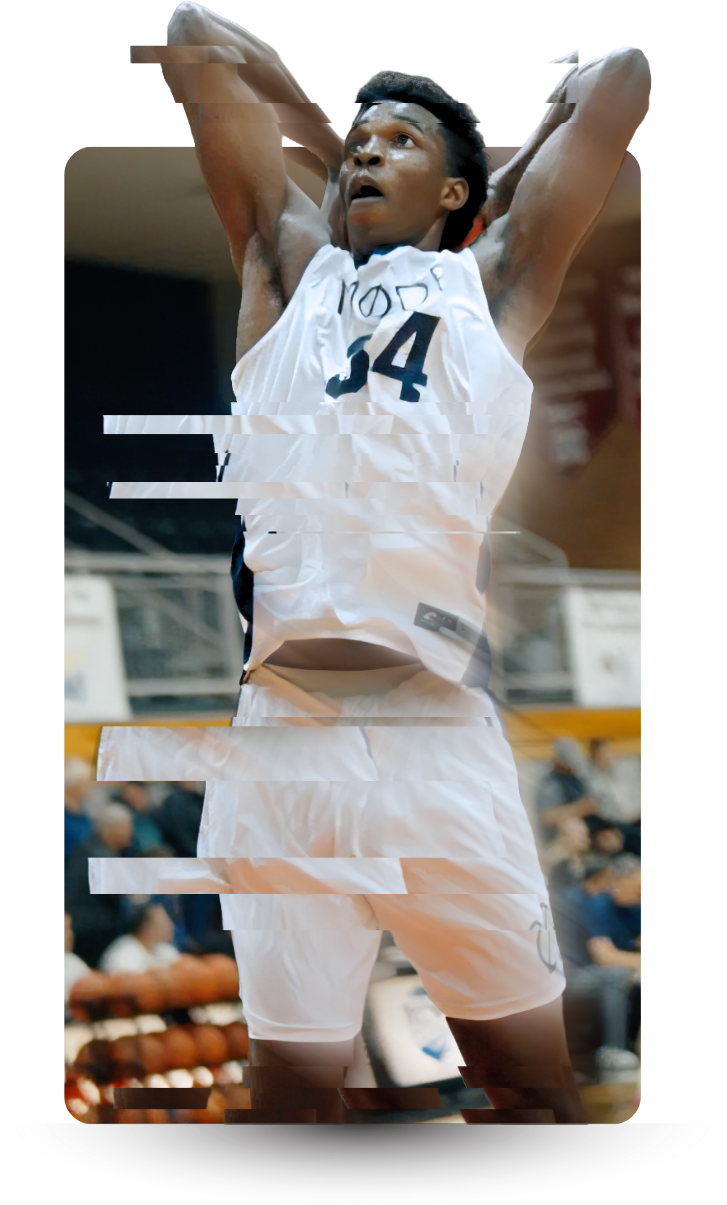 A basketball player in a white jersey with the number 4, standing with arms behind his head during a game.