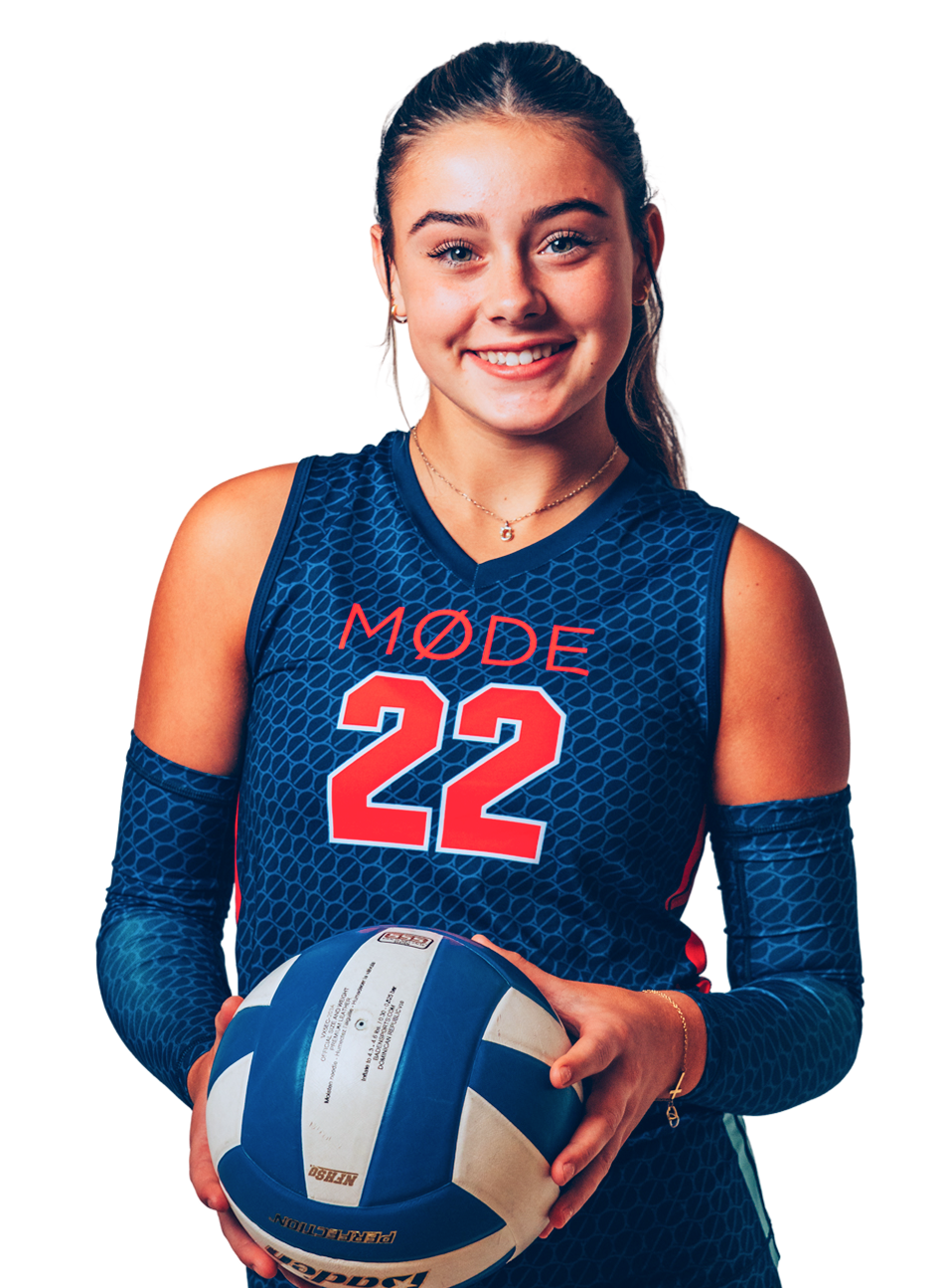 A young woman with long brown hair and fair skin wearing a blue volleyball uniform with the word 'MODE' and the number 22 on it, holding a blue and white volleyball, smiling at the camera.