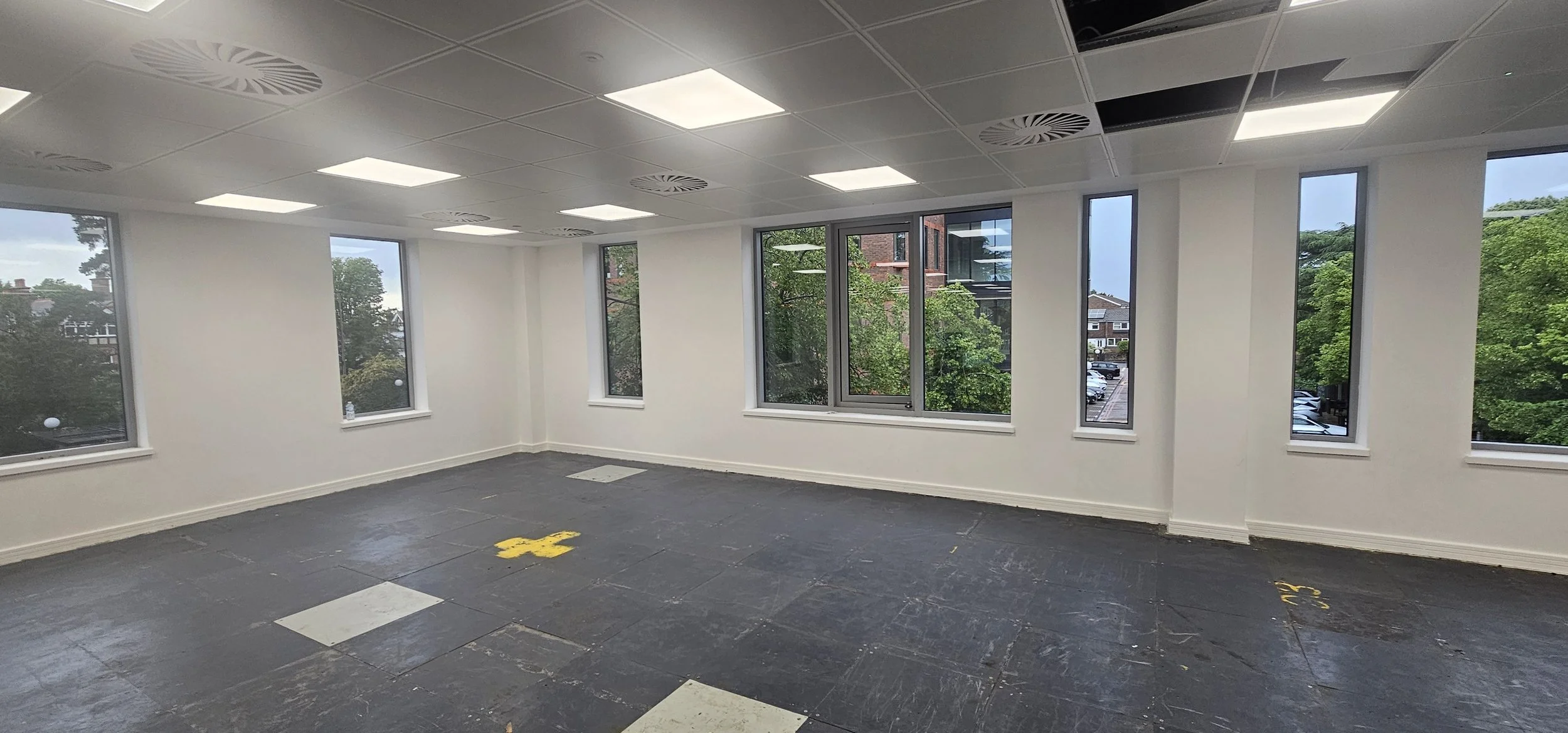 Restored raised access floor panels cleaned to a uniform finish, Guildford