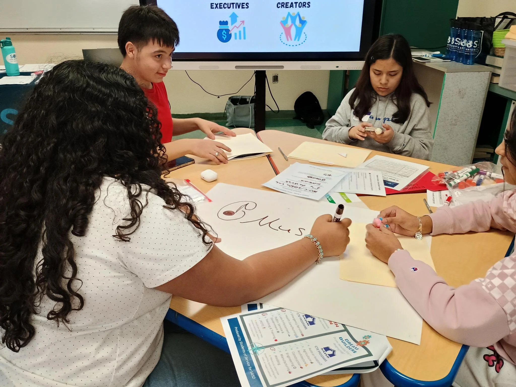 Students work together on a career activity station