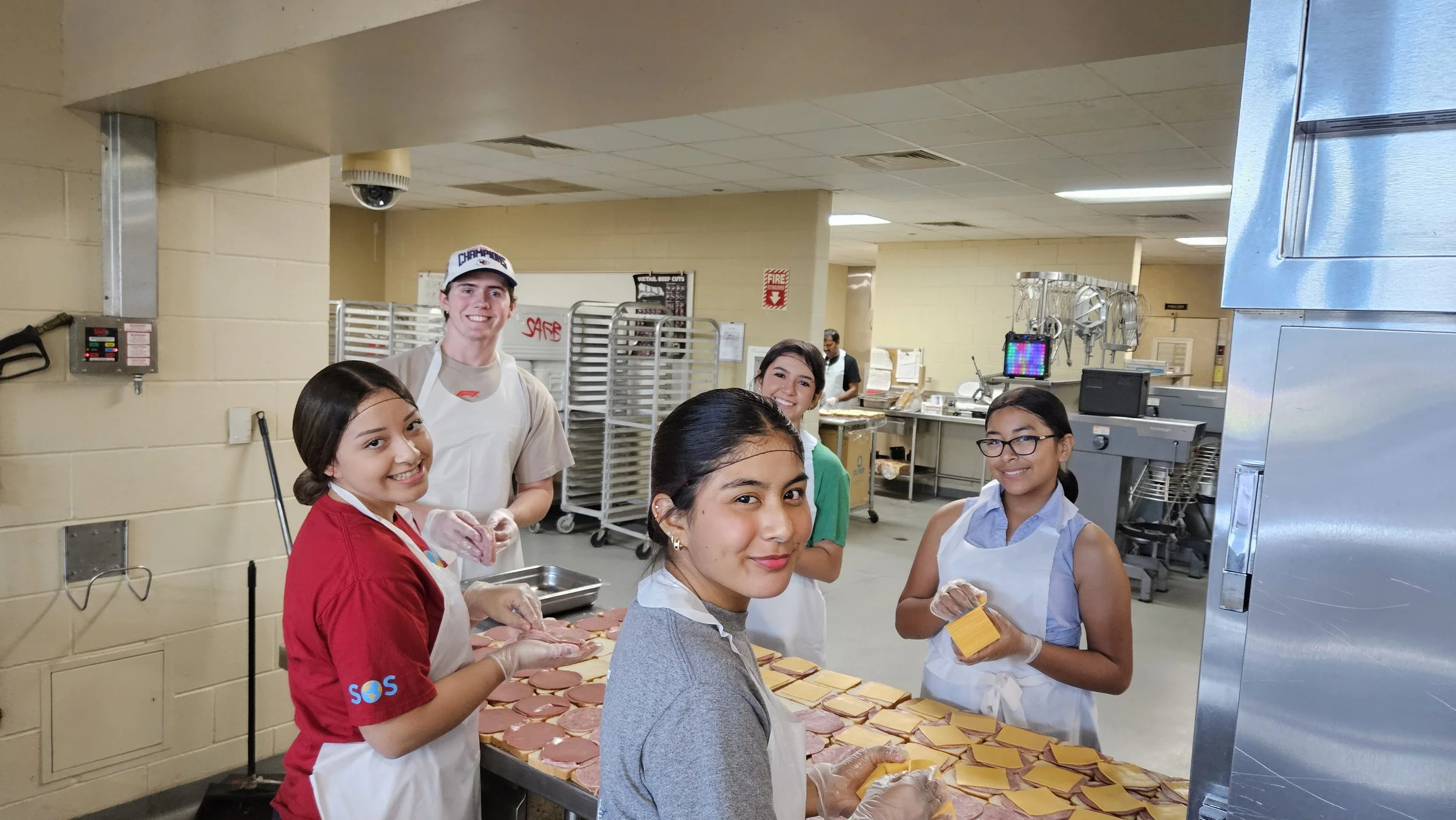 Students preparing meals at a service event