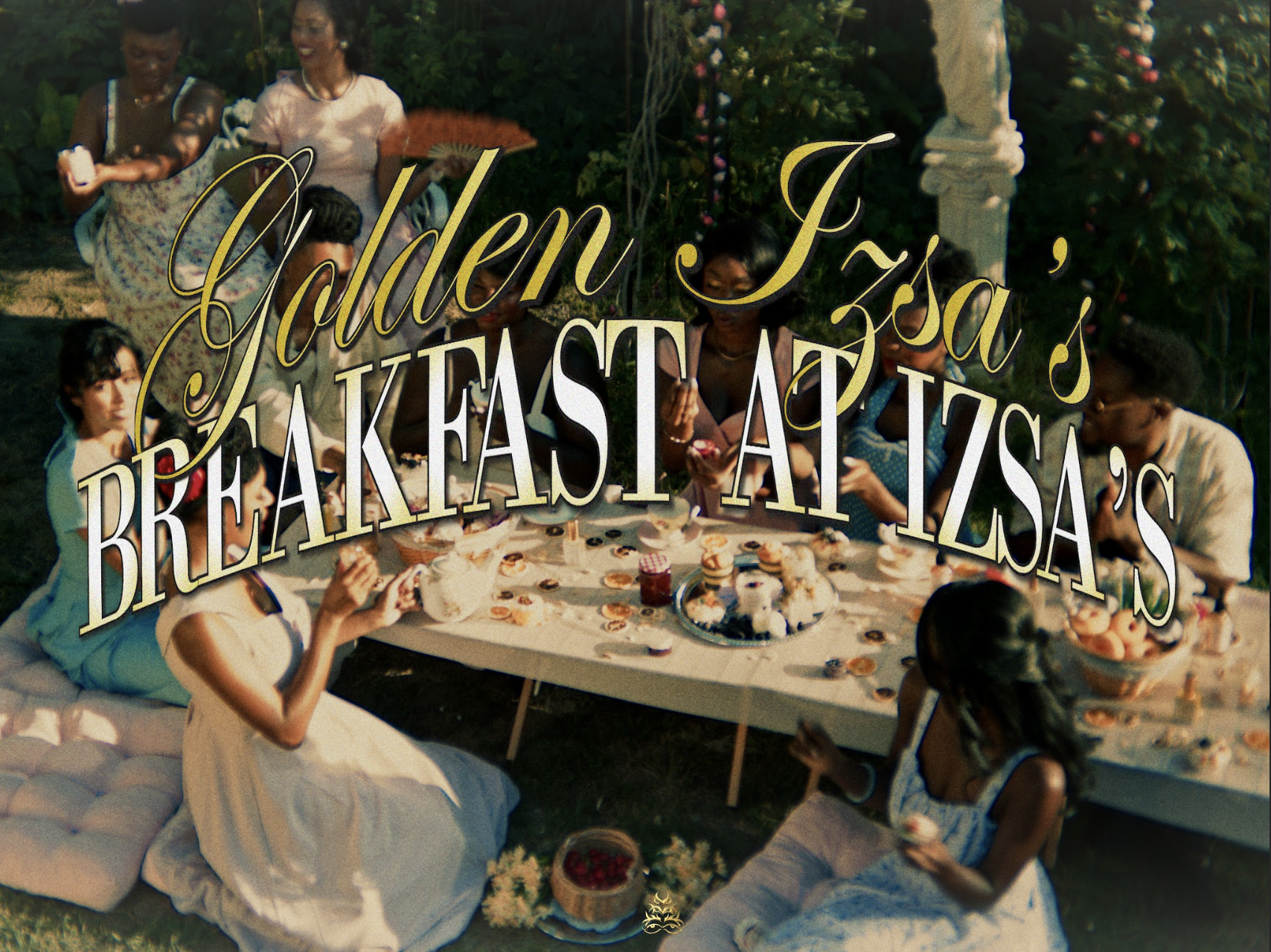 A group of women and children enjoying an outdoor breakfast or tea party, sitting around a table with pastries, cupcakes, and jam, in a garden setting with lush greenery and flowers, with an overlay text that says "Golden Izza's Breakfast at Izza's."