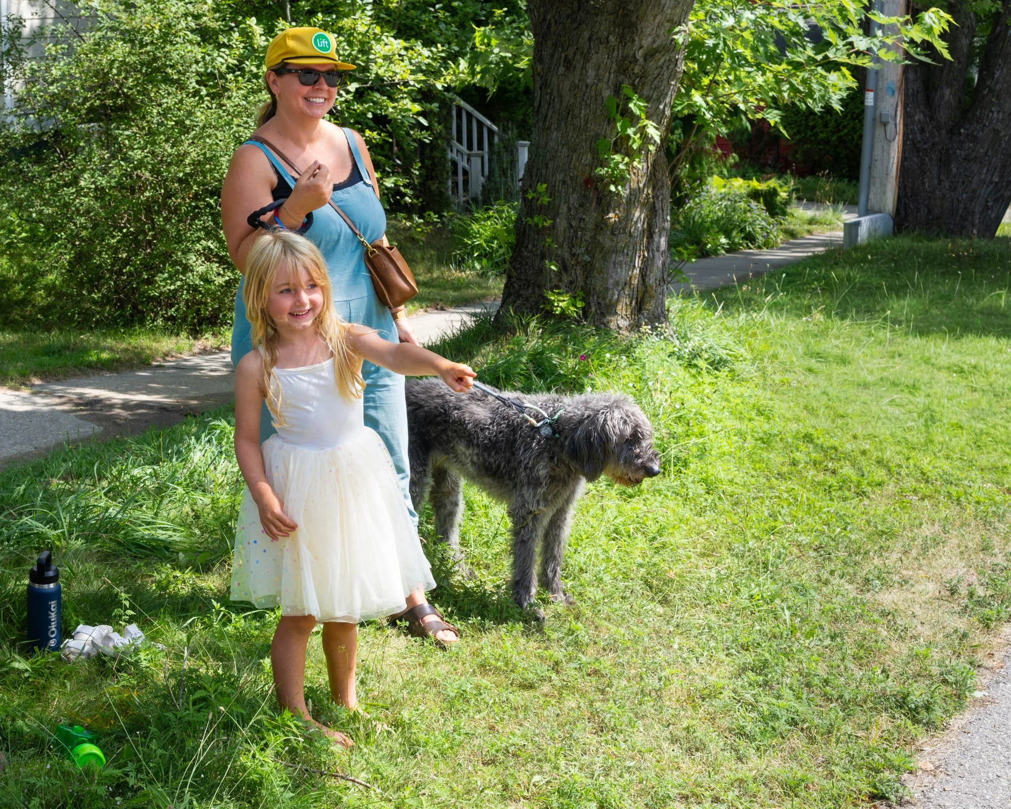 Mom, daughter and pup watching.jpg