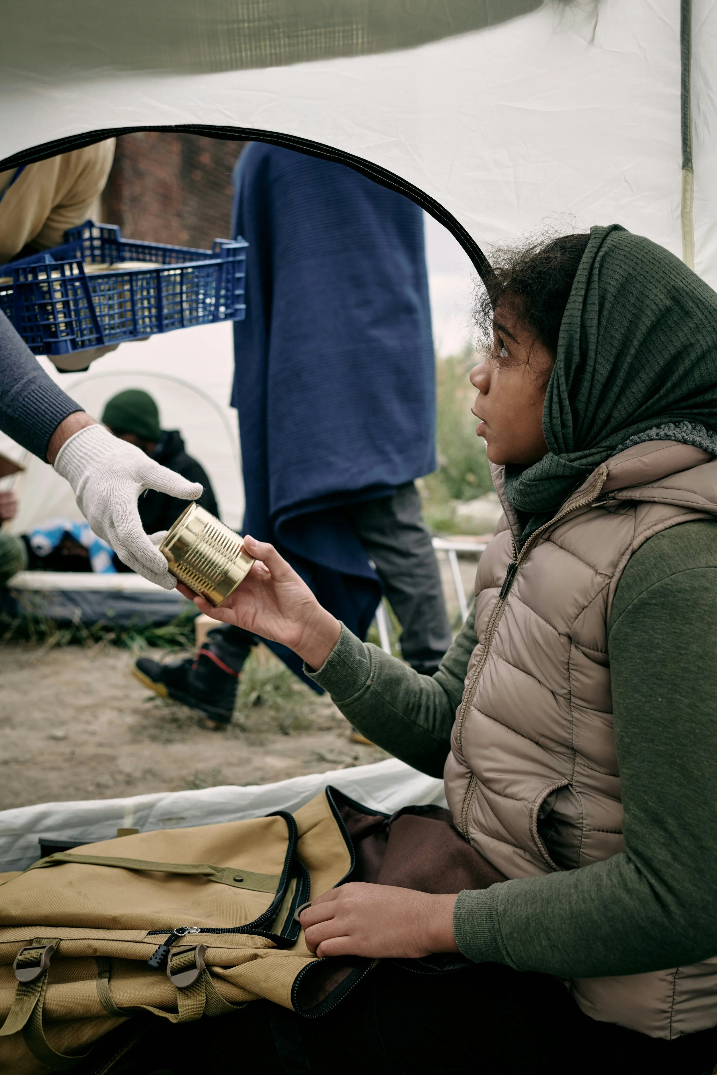 Homeless girl getting food from hunger relief agency