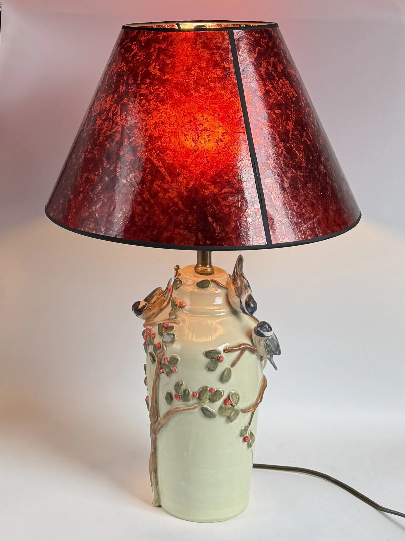 Black-capped Chickadees on lamp