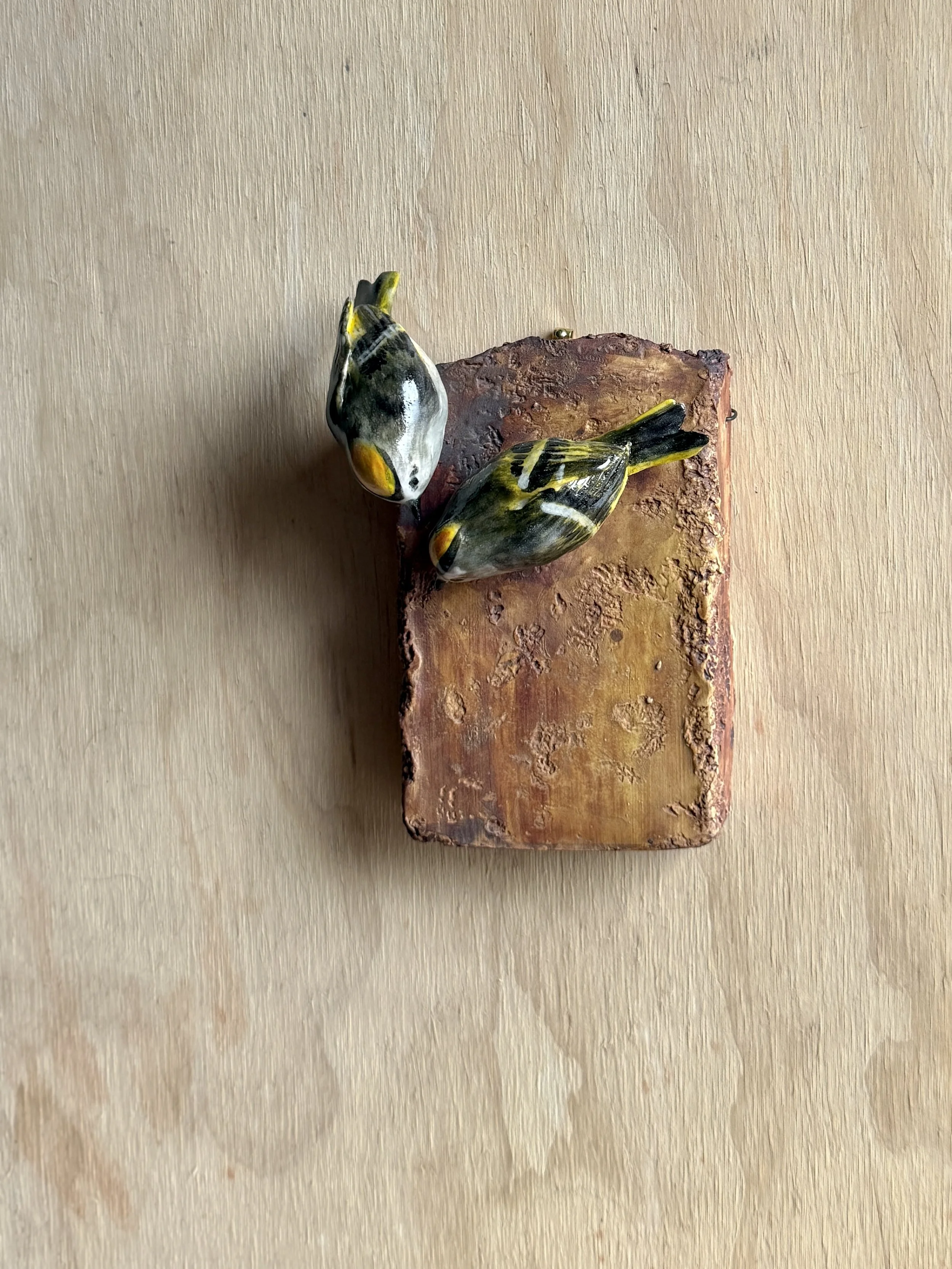 Golden-crowned Kinglets on wall plaque