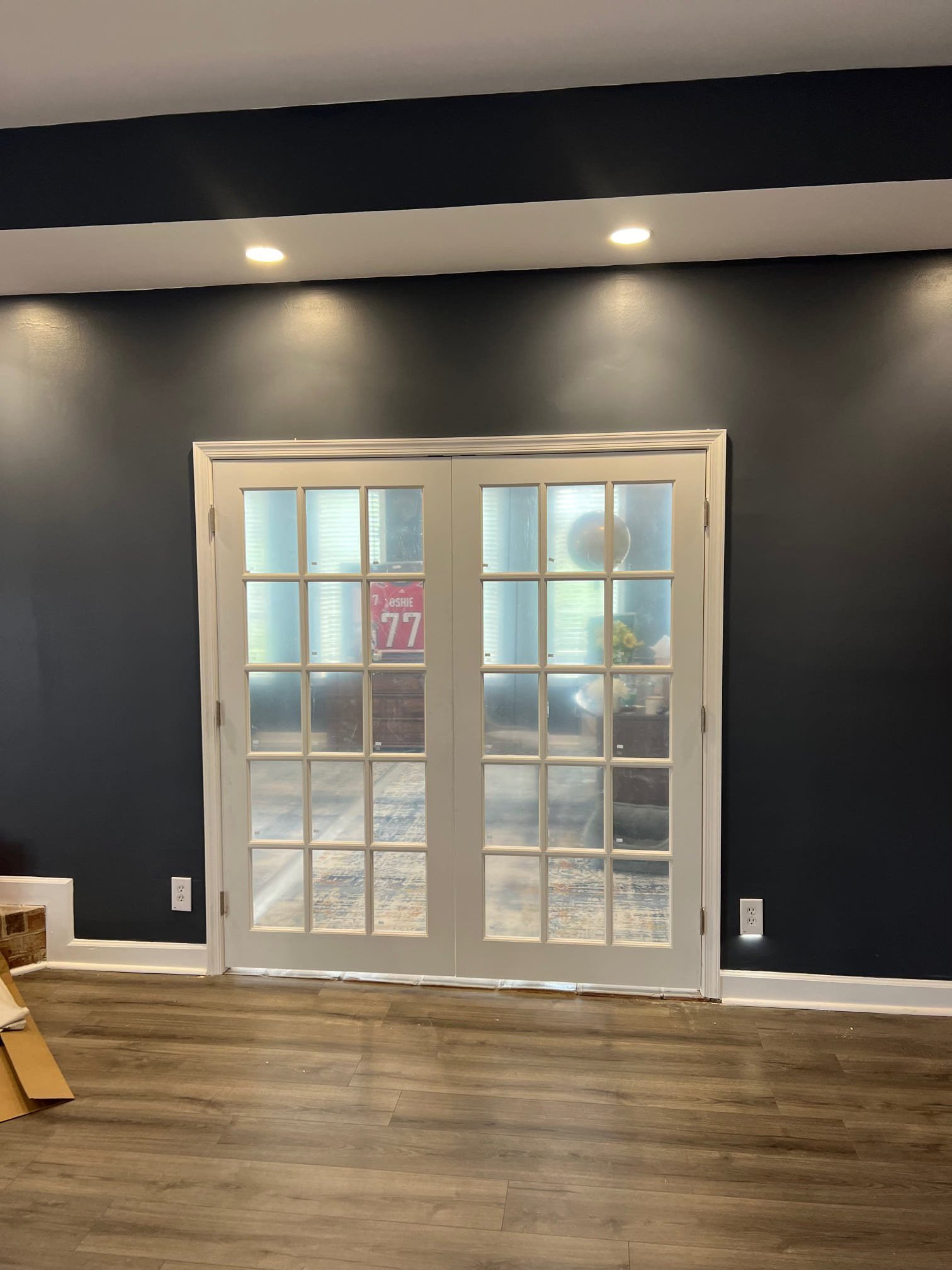Added elegant French doors to divide the basement space while keeping it bright and open. A perfect mix of style and practicality.