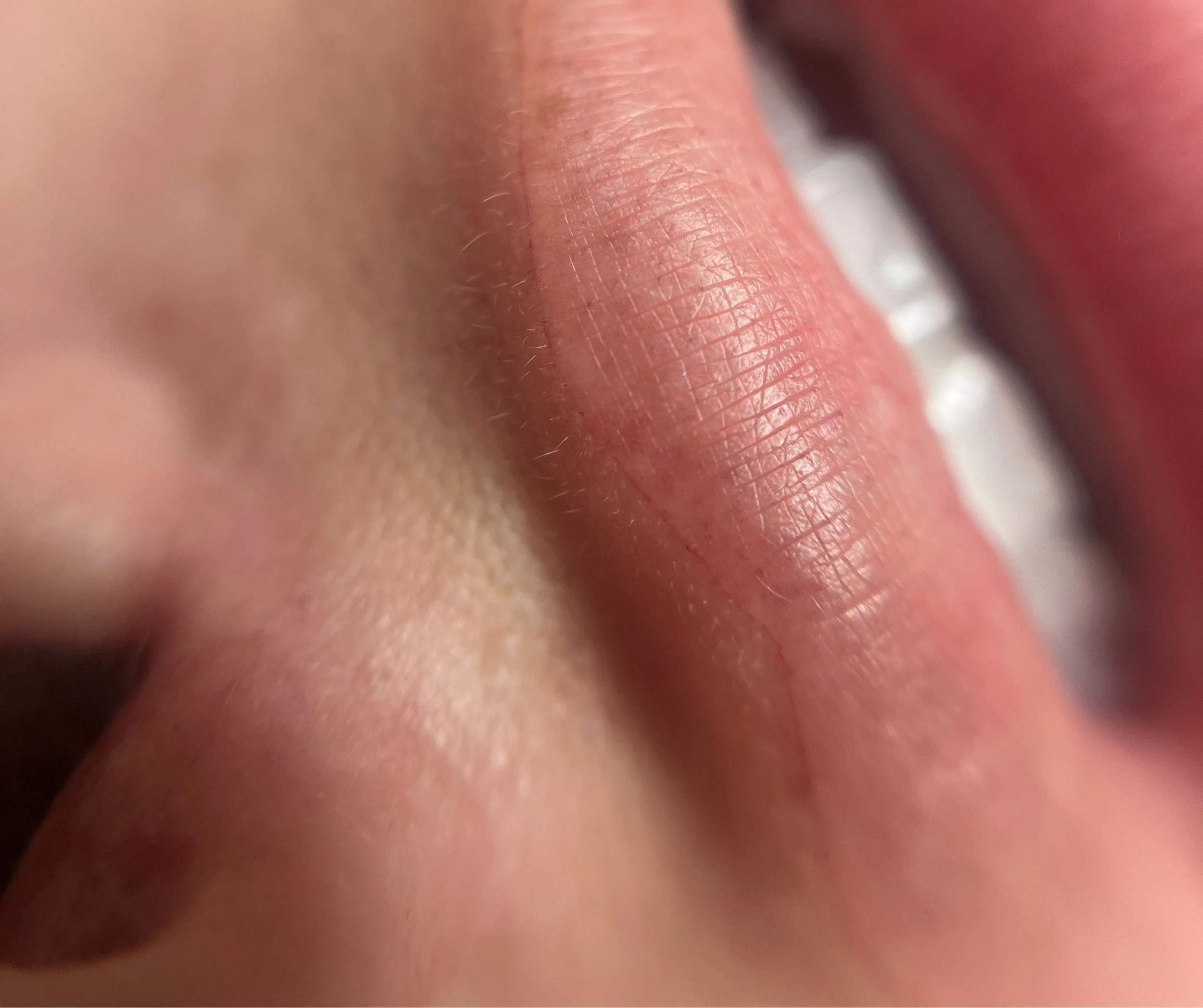 Close-up of a person's lips, showing the texture and natural lines of the lips.