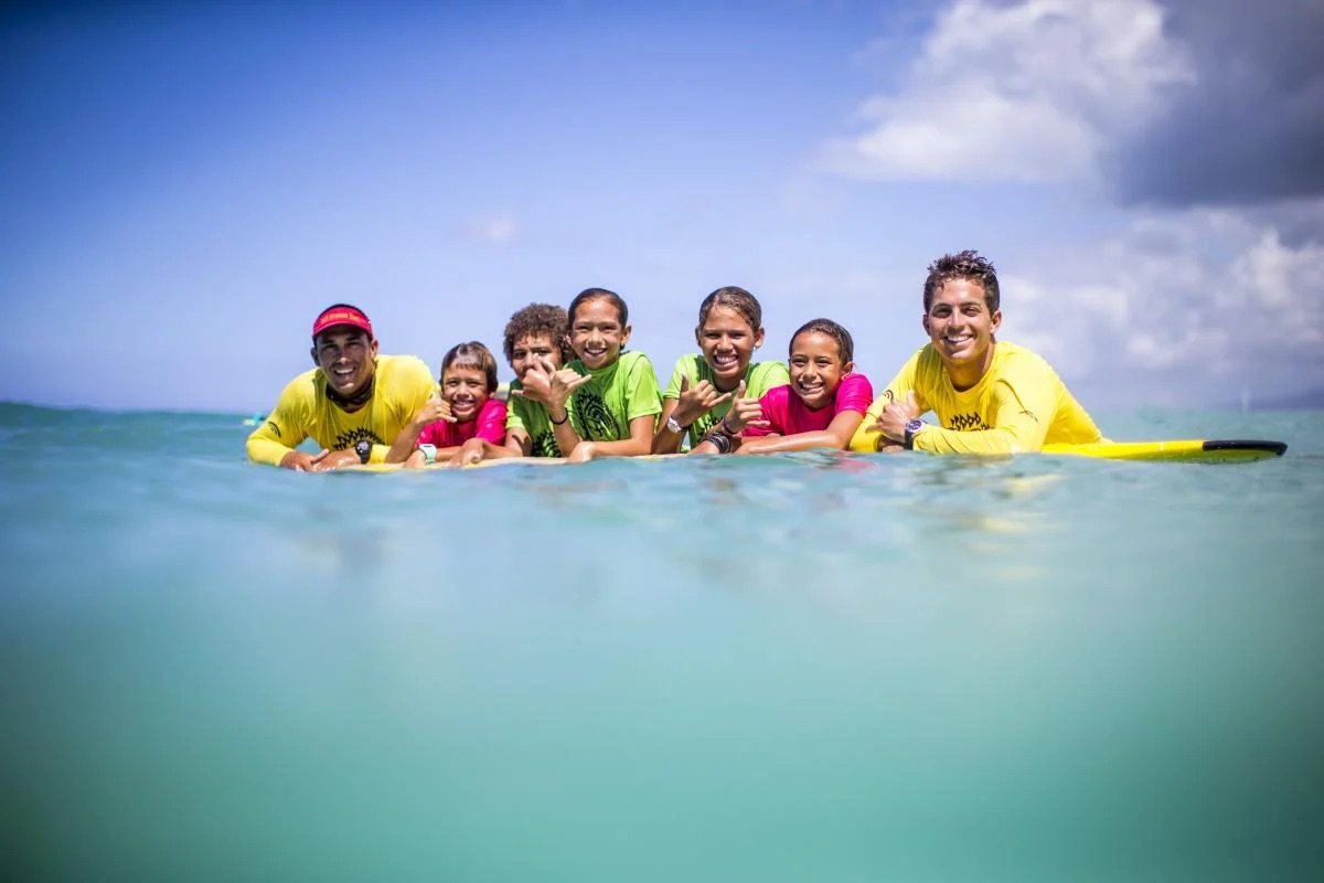 Kai-Duane-and-children-in-ocean_0.jpeg