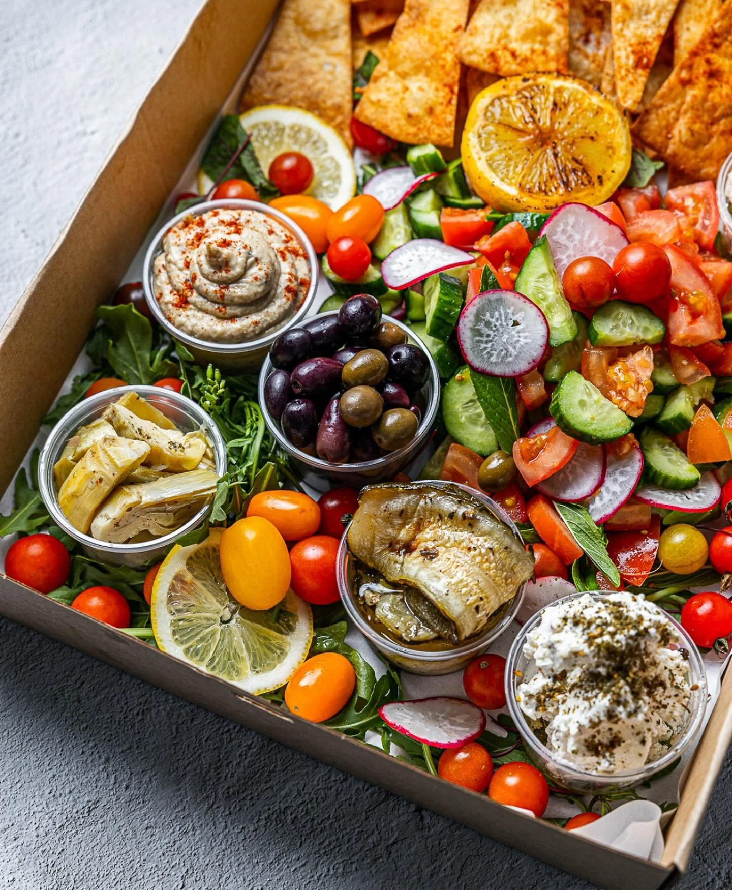 Grazing platters available for delivery Sydney metro. This is our mezze vegan platter with fattoush salad, eggplant, hummus, olives, pita chips. Enquiries info@seasaltclovelly.com.au