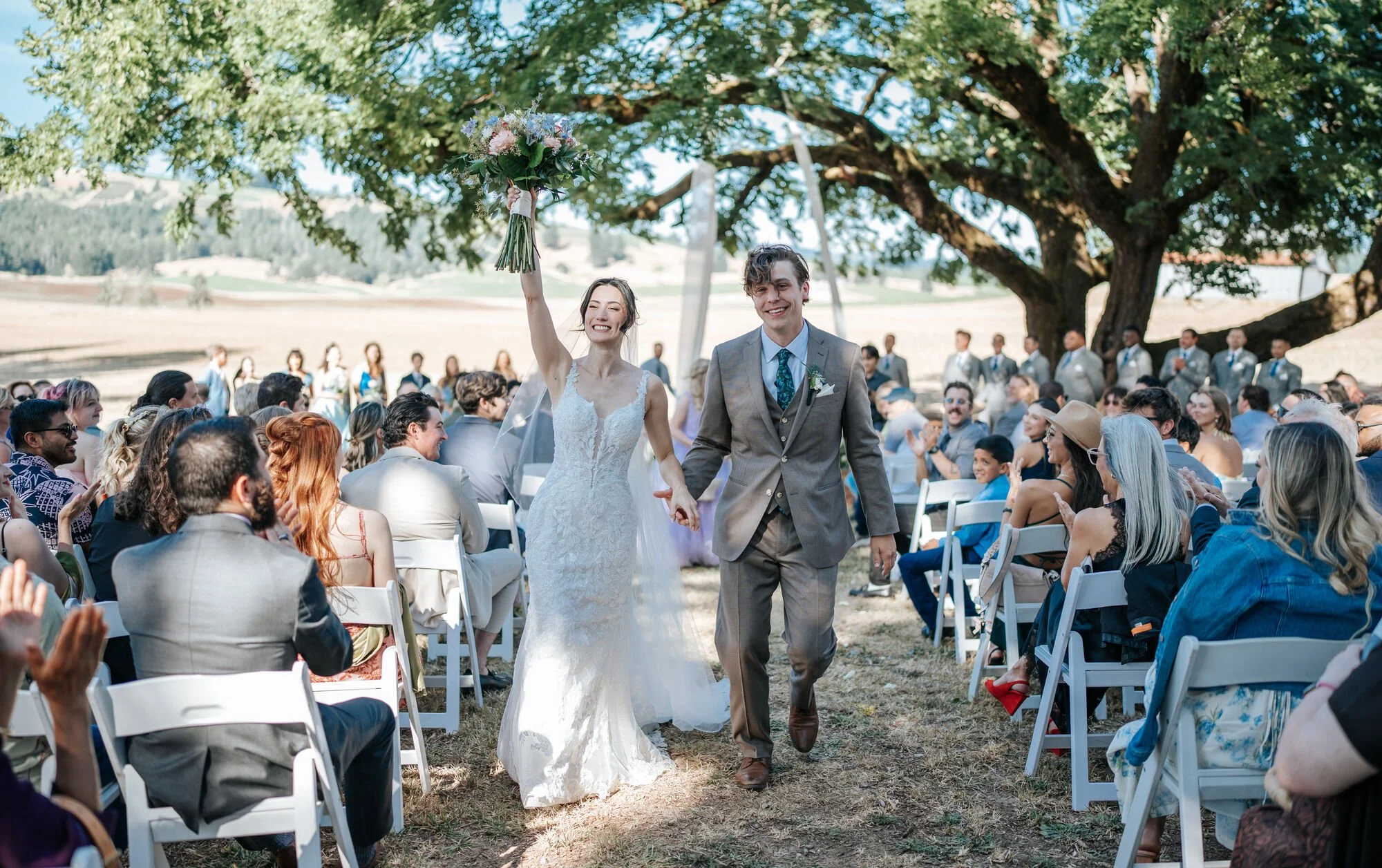 Tex Kelly Productions wedding photography in a redwood forest — bride and groom just married celebration in Humboldt County, Arcata wedding photographer