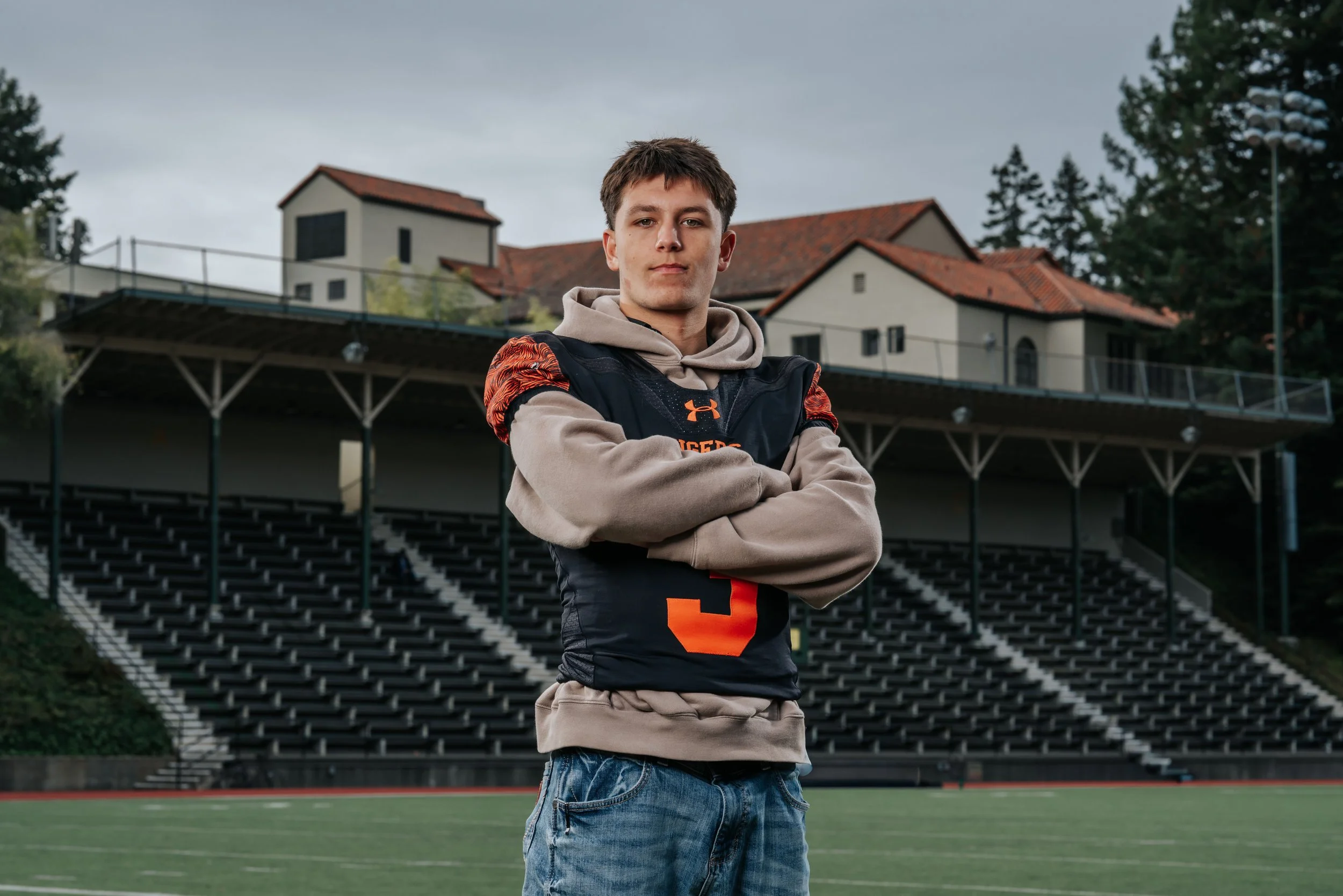 Senior athlete portrait at a Humboldt County high school football stadium by Tex Kelly Productions senior photographer