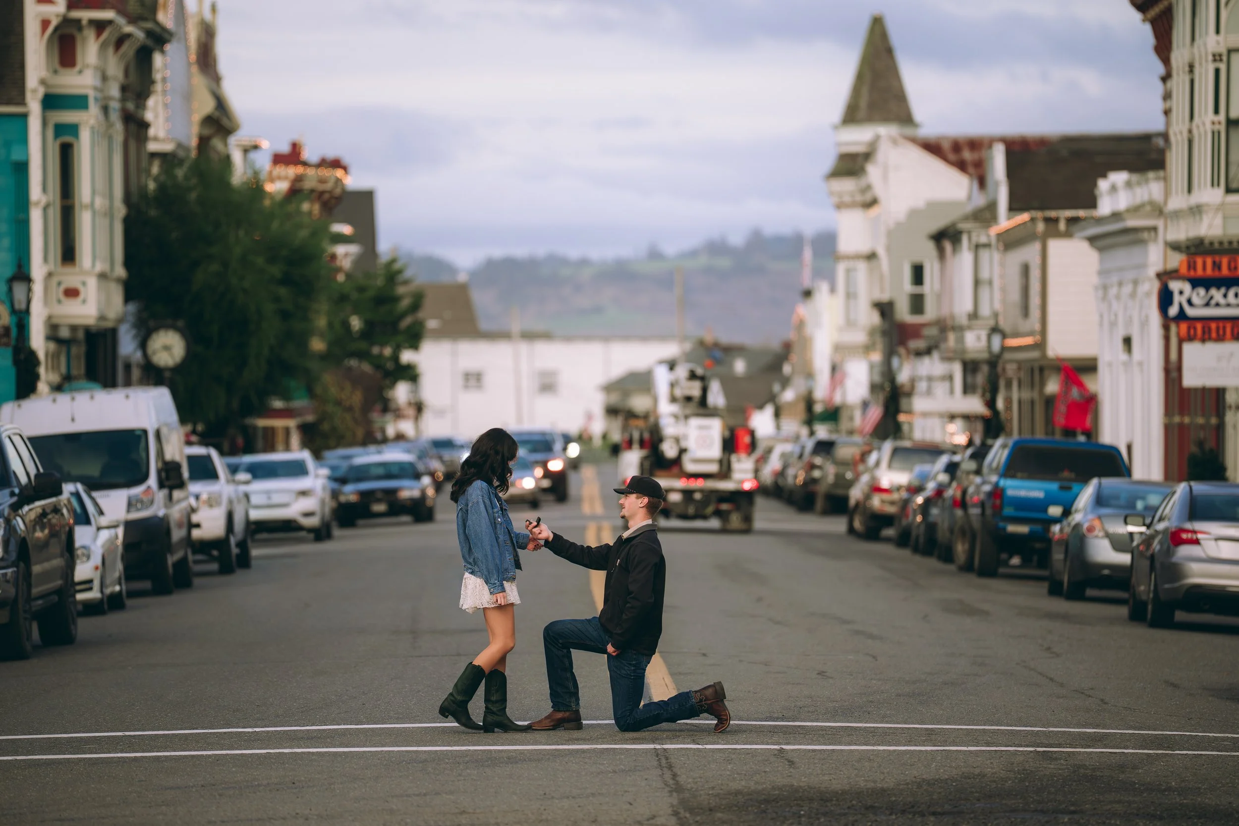 Surprise proposal on historic Ferndale Main Street in Humboldt County California by Tex Kelly Productions - Victorian town engagement photography