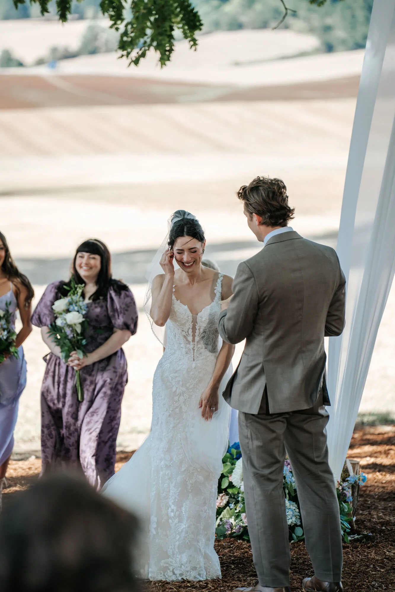 Tex Kelly Productions elopement and wedding photography in Humboldt County — bride in gown greeted by guests at an intimate McKinleyville outdoor ceremony