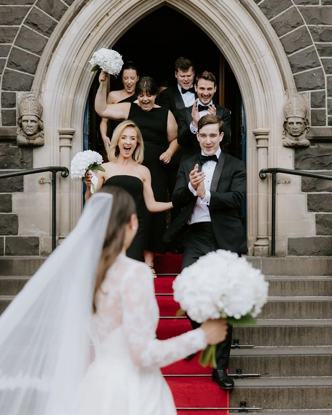 Here&rsquo;s Katherine, freshly married, just walked back down the aisle and turning round to soak in some hugs from her bridal party! I absolutely love this part of the day, the joy is palpable!
Check out some more frames from their gorge wedding at