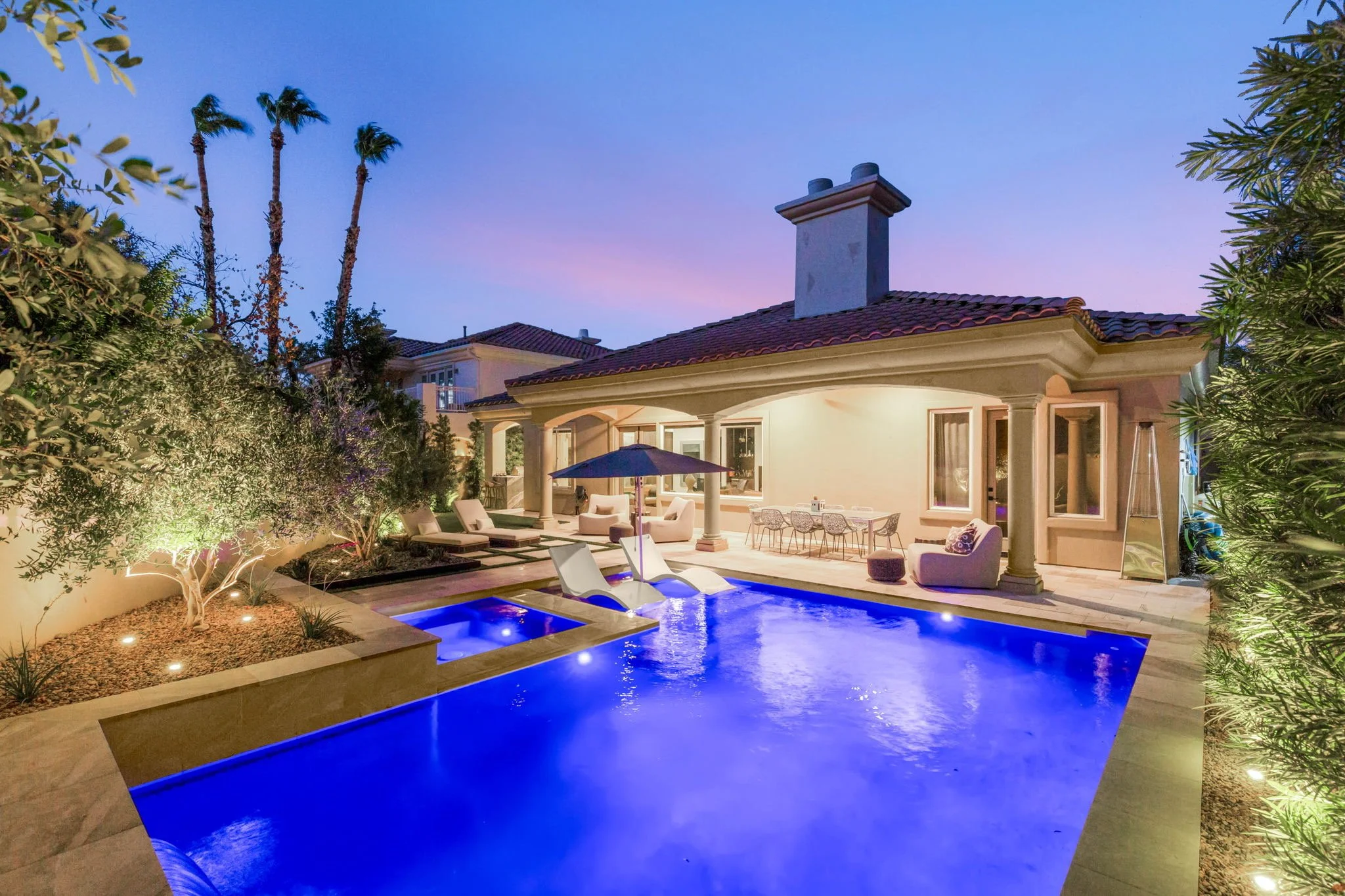 Custom luxury backyard pool and hardscape landscape installation on Avenida Fiori in Henderson, NV.