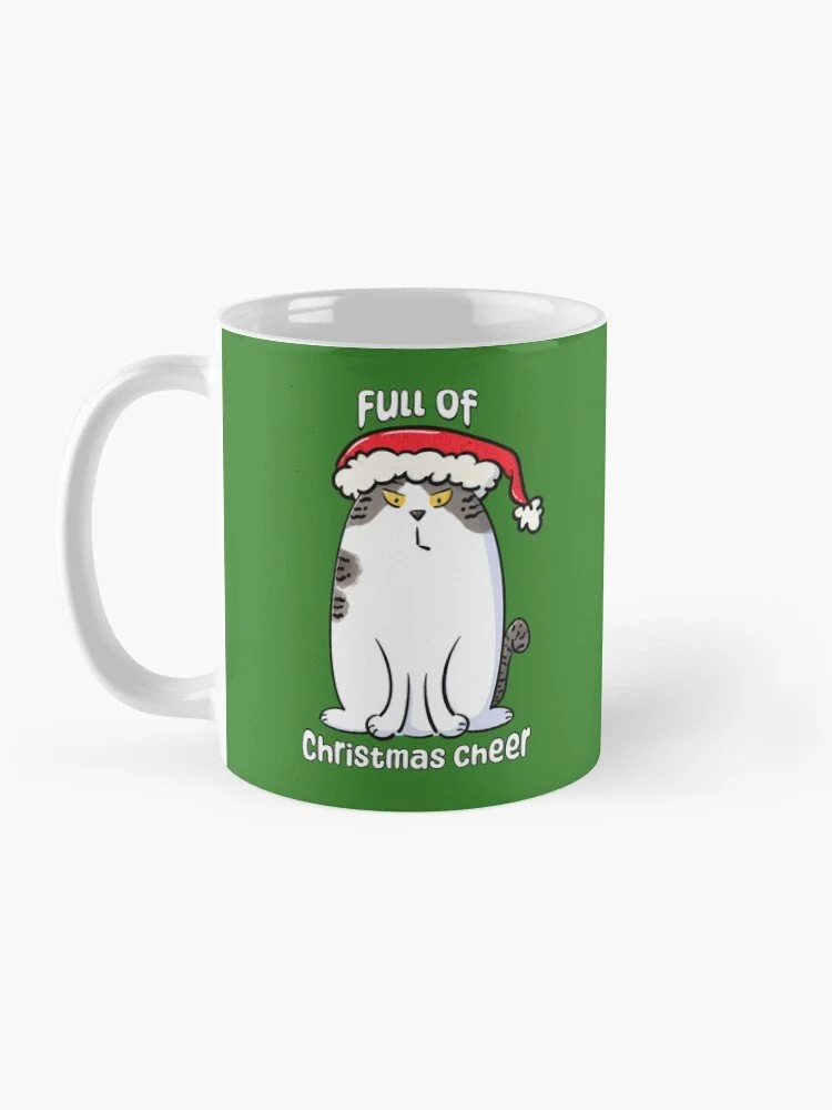 angry brown and white tabby cat in a santa hat