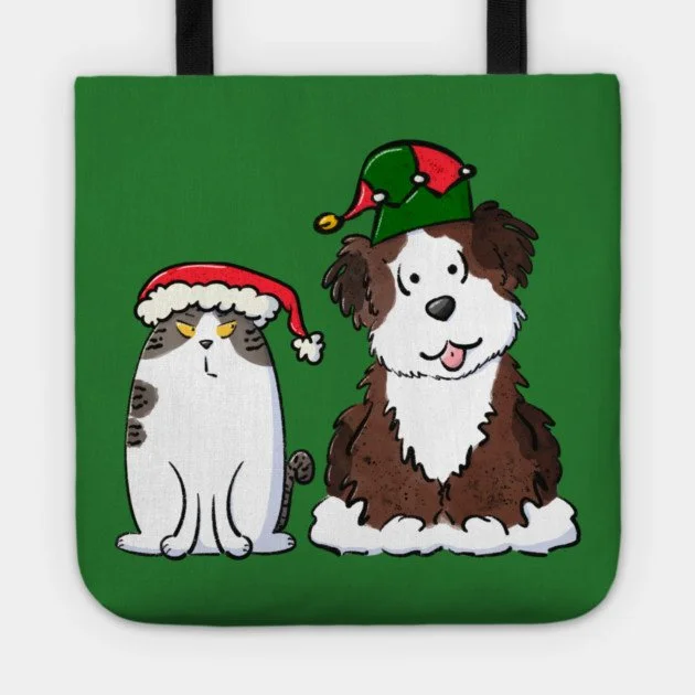 angry brown and white tabby cat in santa hat and happy brown and white dog in elf hat