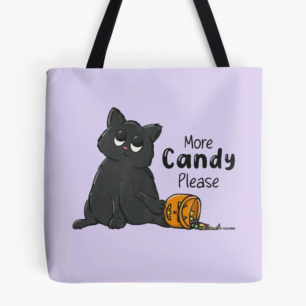 purple tote bag with image of a cute black cat tipping over a pumpkin bucket of candy