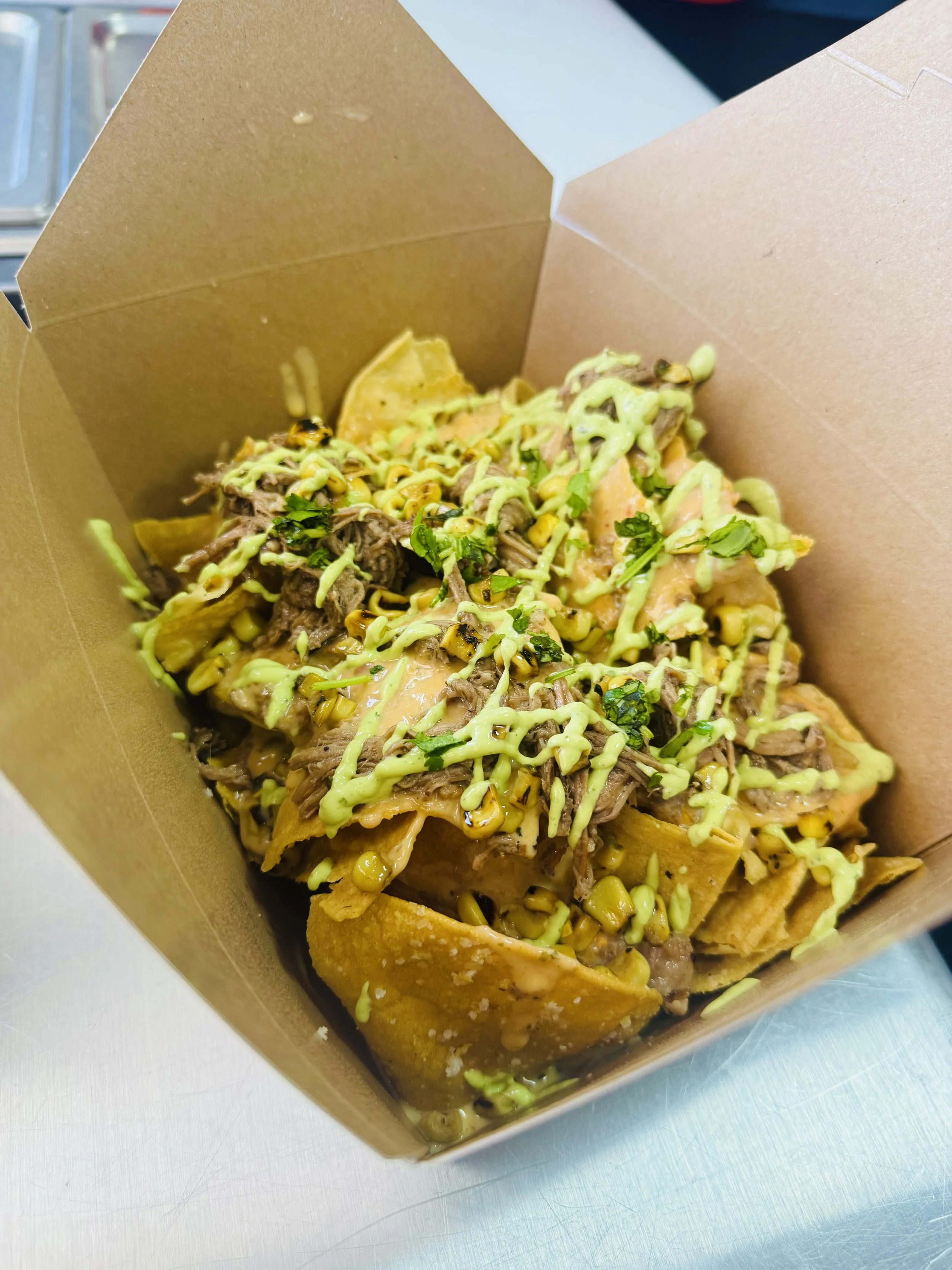 Four Corner Nachos with slow smoked brisket