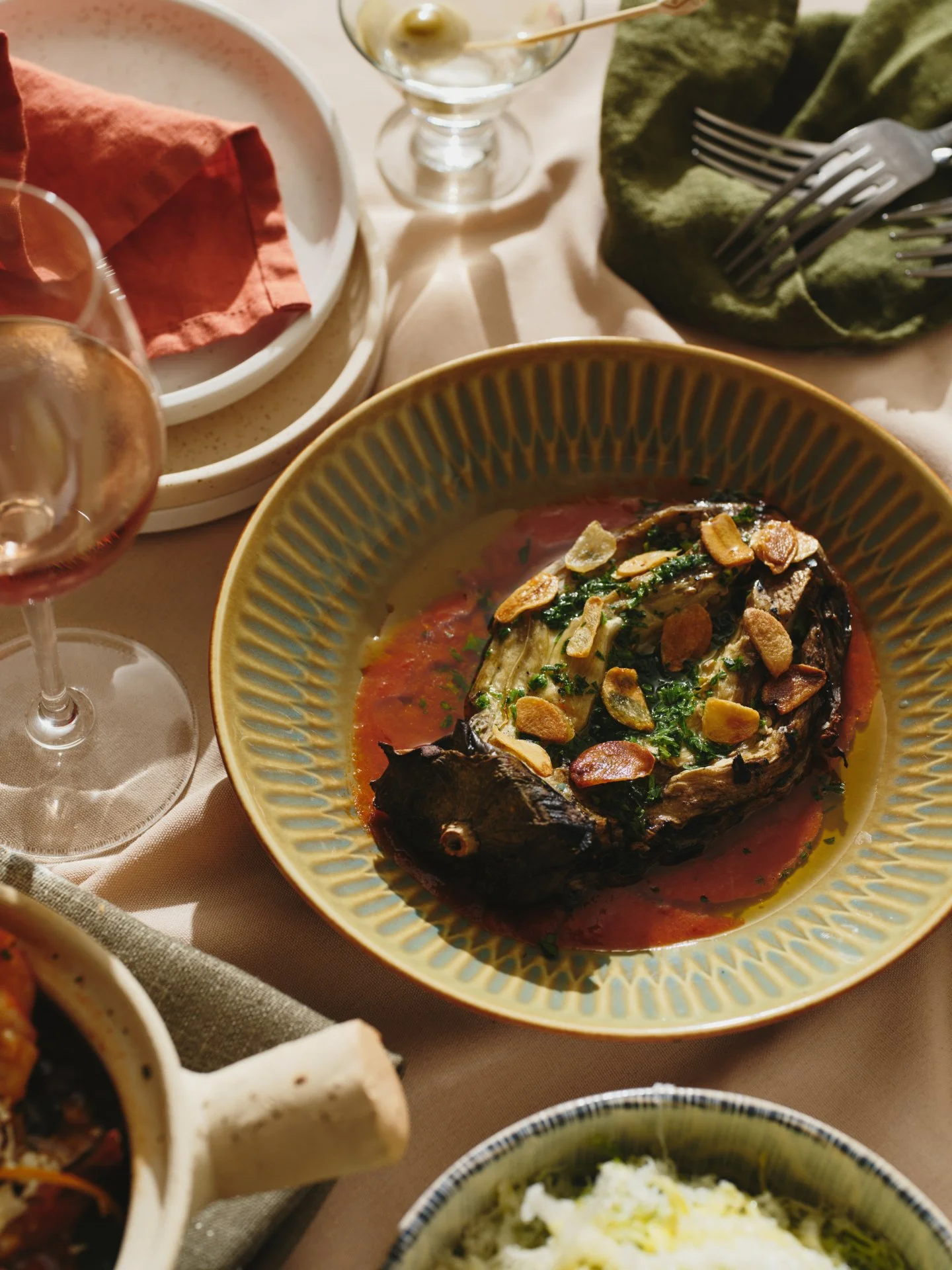 Melitzanes. Eggplant roasted until tender, lifted with tomato and garlic oil.