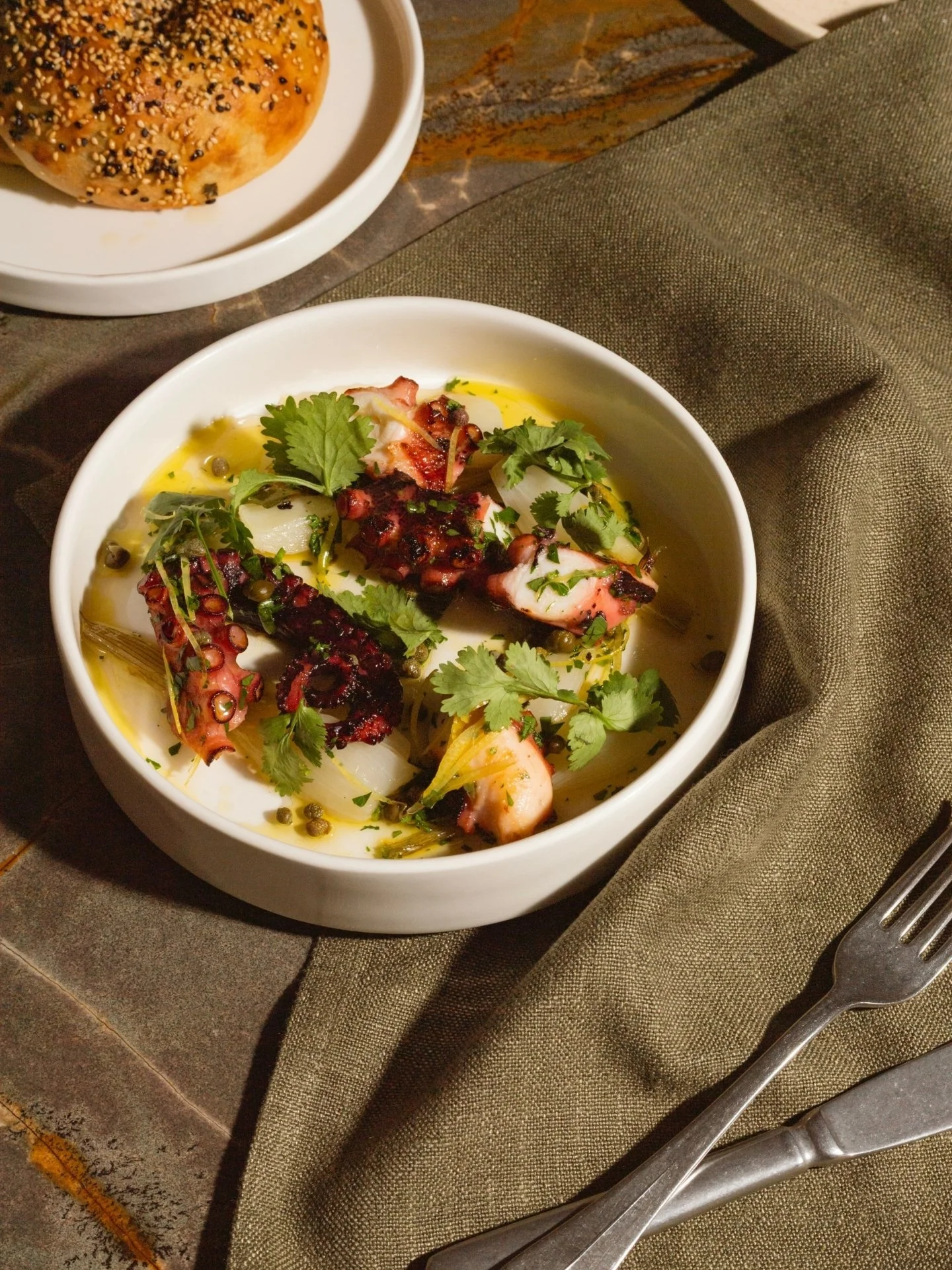 Octopus done the Greek way. Tender chtapodi with onions, capers and a bright hit of lemon.