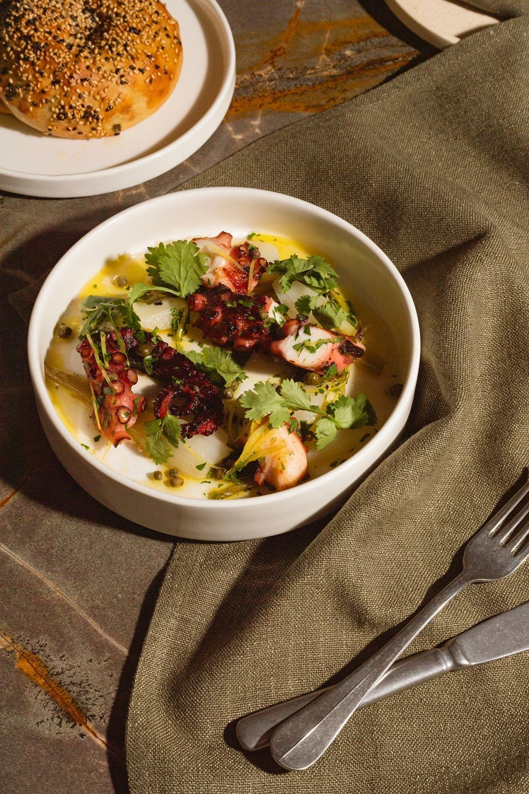 Chtapodi, straight off the fire. Octopus with onions, capers and lemon.