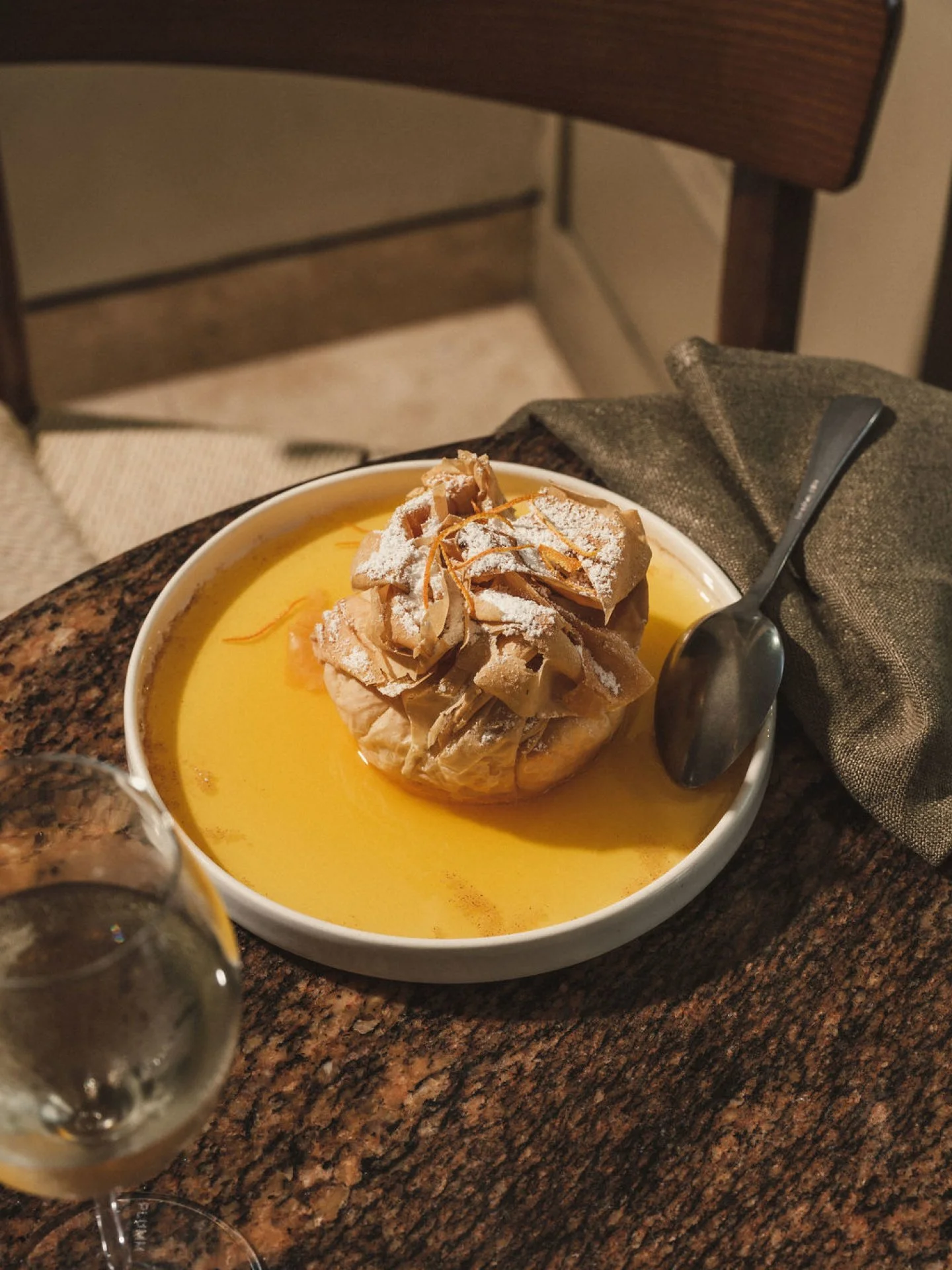 A Greek classic that's well travelled. Bougatsa, crisp filo, warm semolina custard, a hit of mandarin.