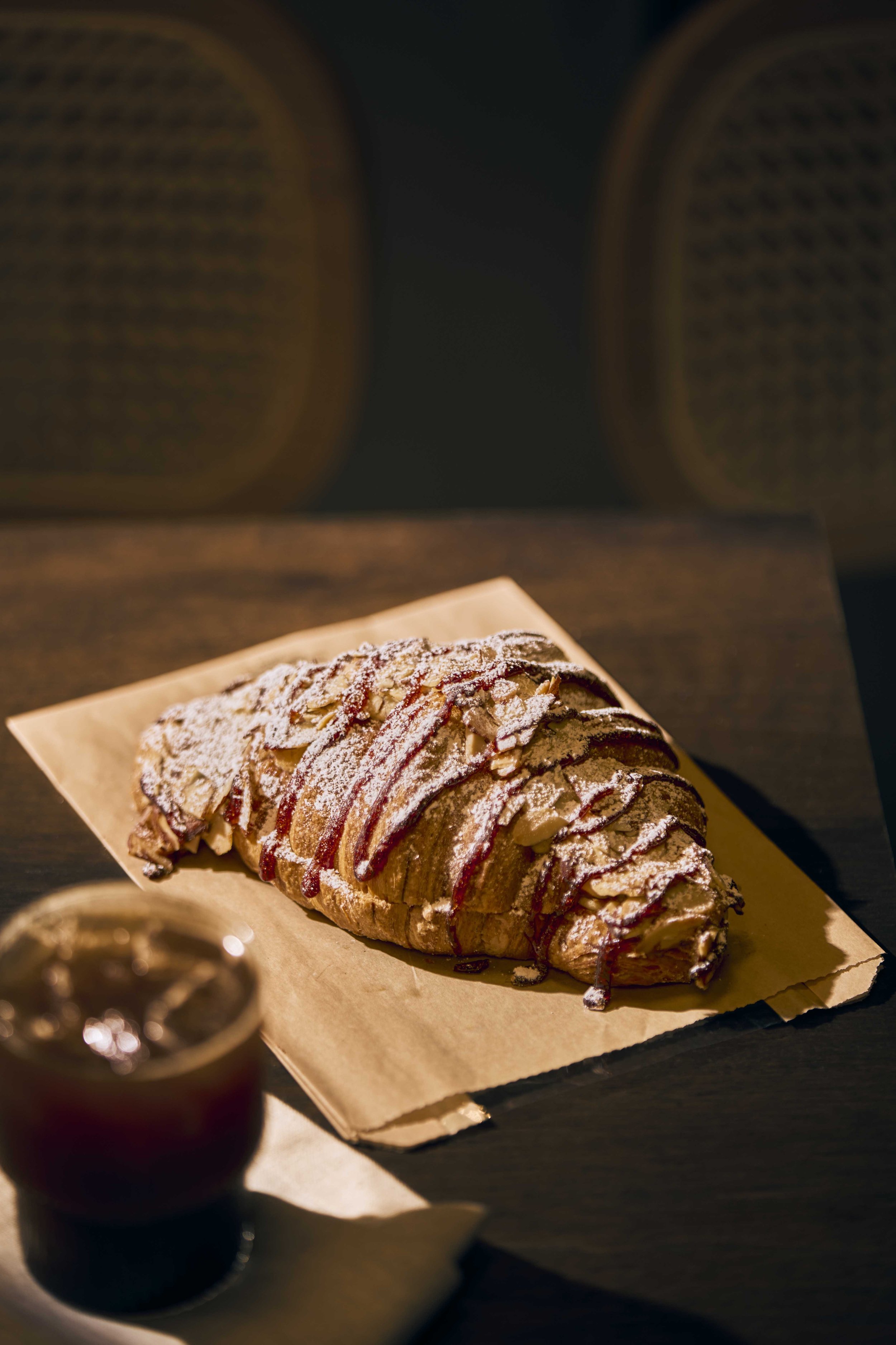ocho raspberry almond croissant on kraft paper