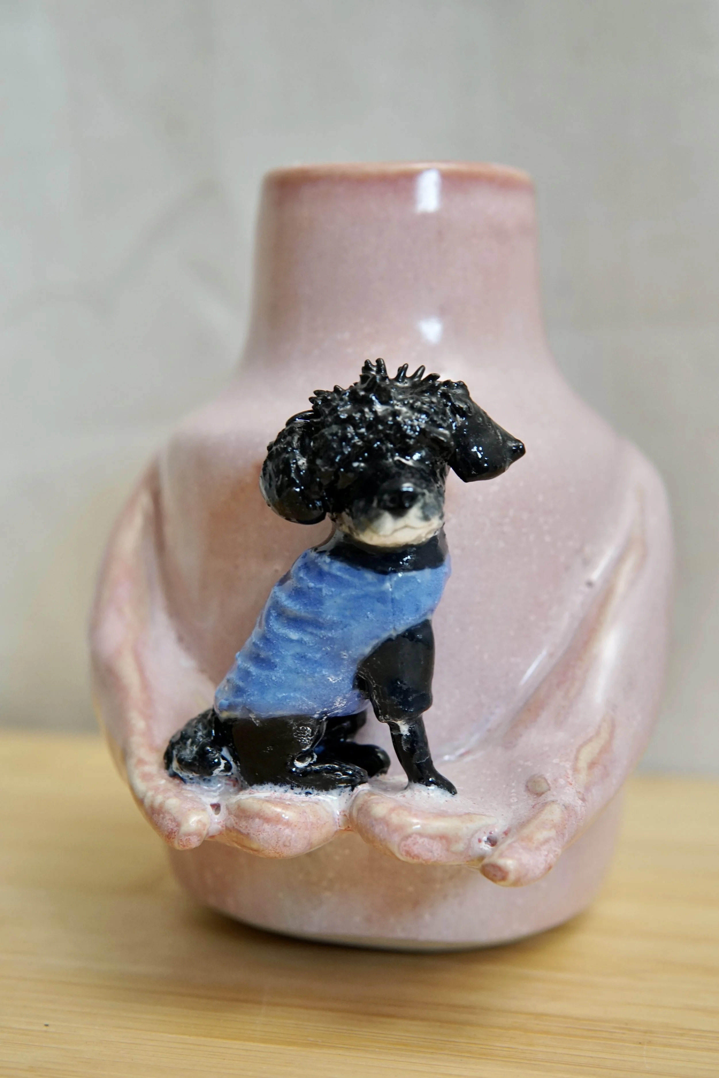 Dog in hand flower vase