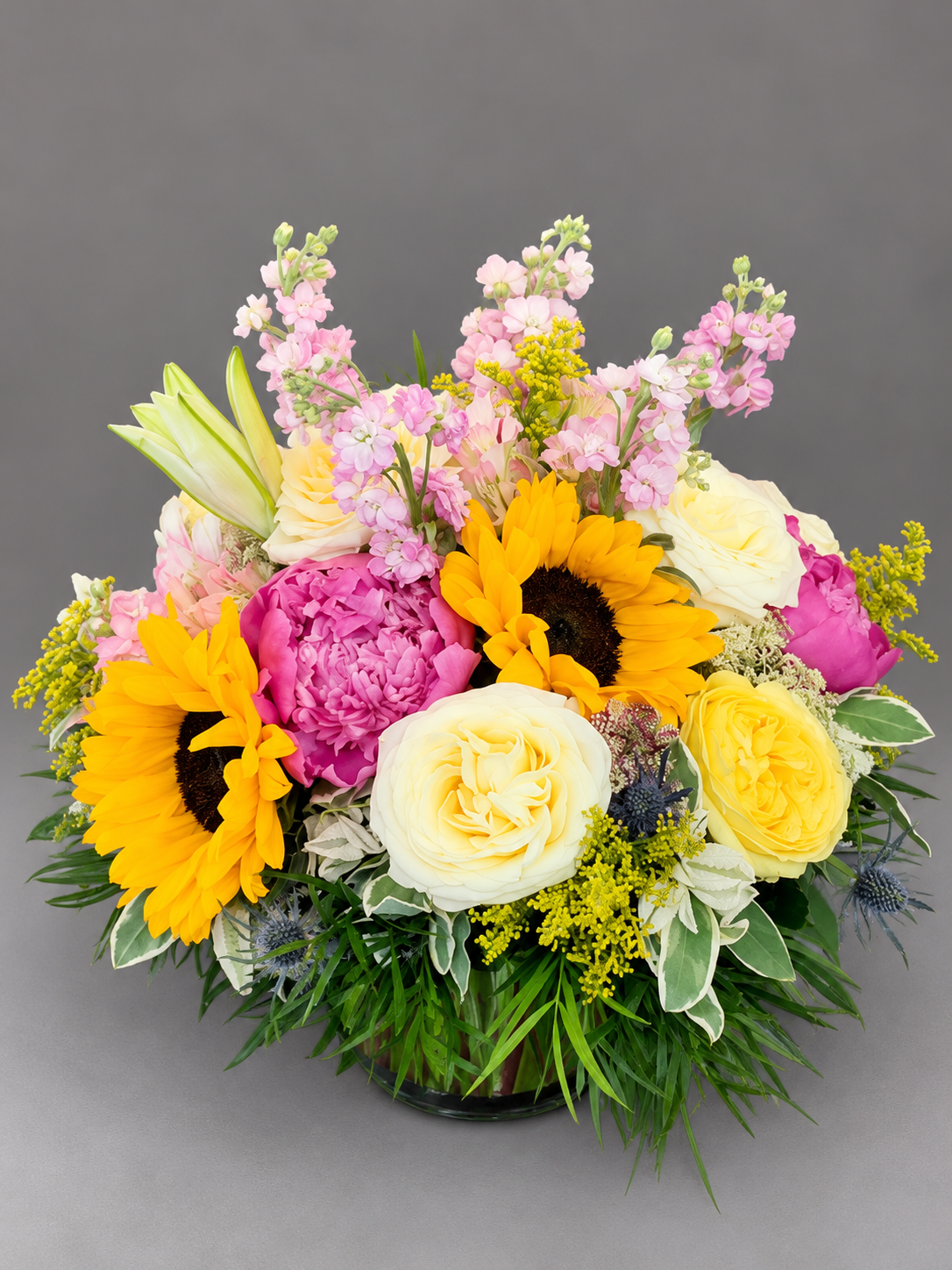 Vibrant Mixed Flower Bouquet in Glass Vase (1).png