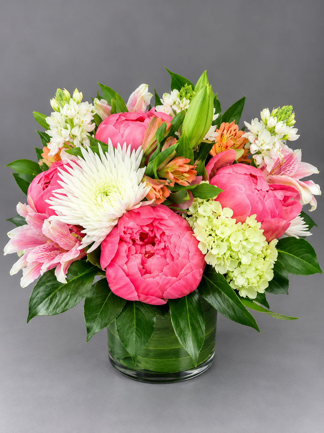Vibrant Pink Peony Bouquet in Glass Vase.png