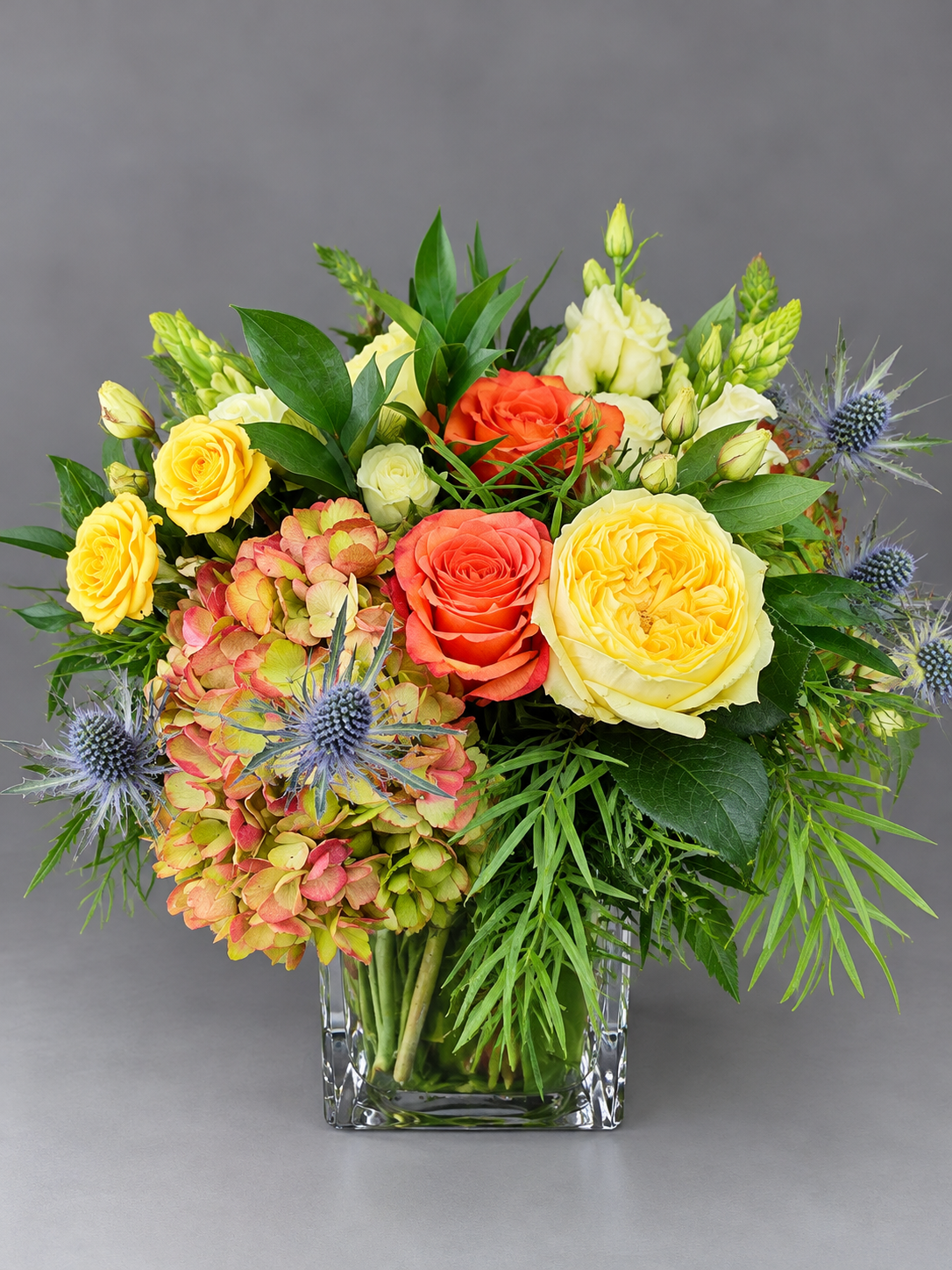 Lush Garden Bouquet in Glass Vase.png