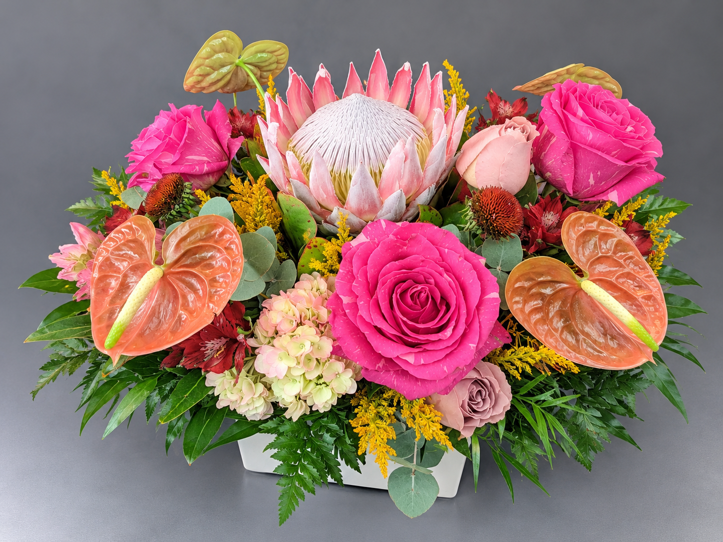 Vibrant Protea and Rose Centerpiece.png