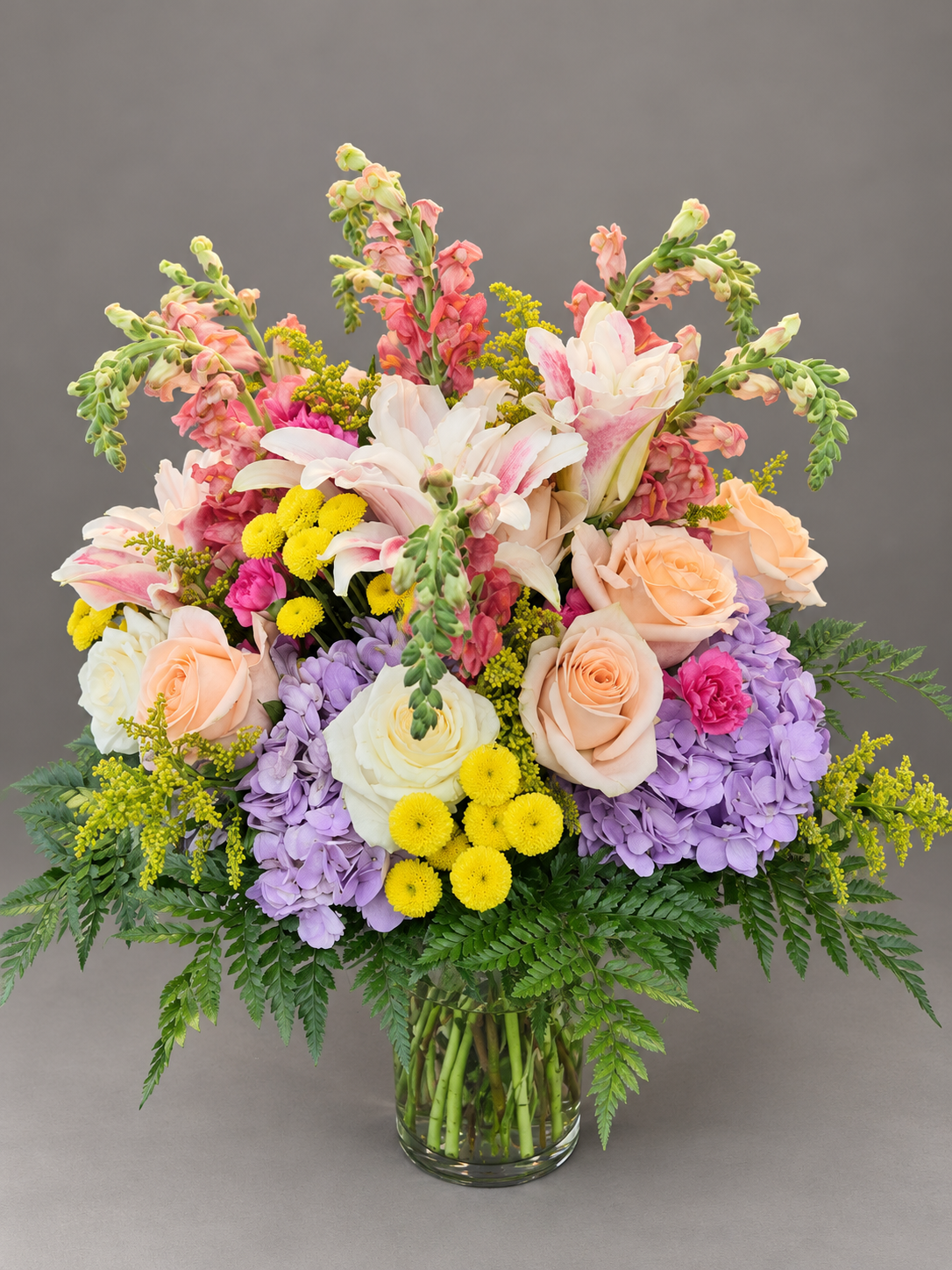 Vibrant Garden Bouquet in Glass Vase (1).png