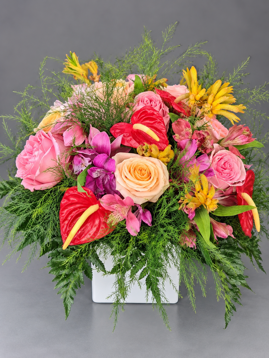 Lush Mixed Flower Bouquet in White Vase (1).png
