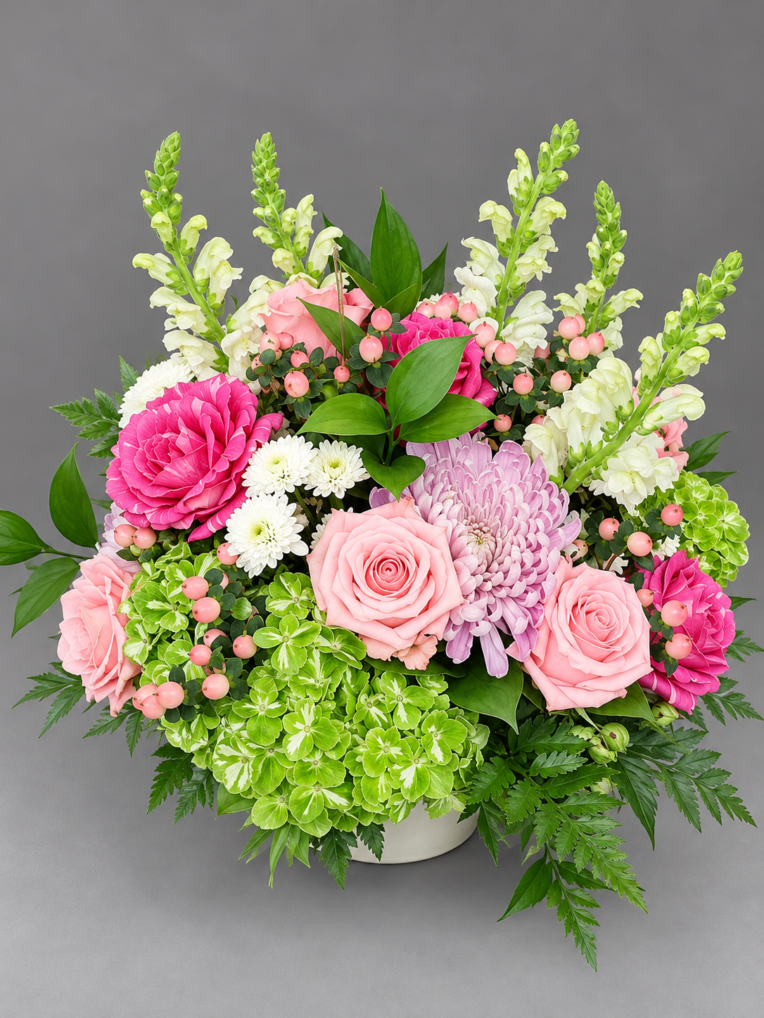 Lush Pink and Green Floral Centerpiece.png